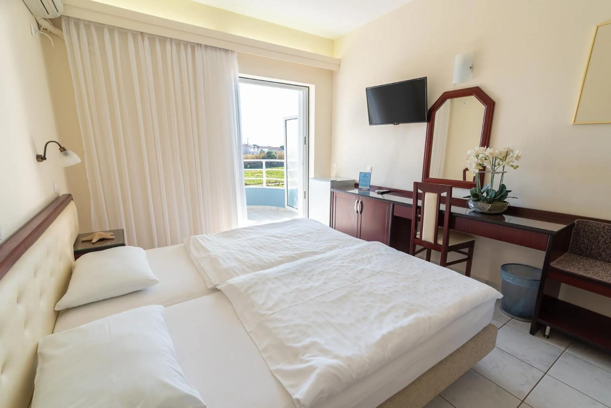 Bed in Dionisos Hotel