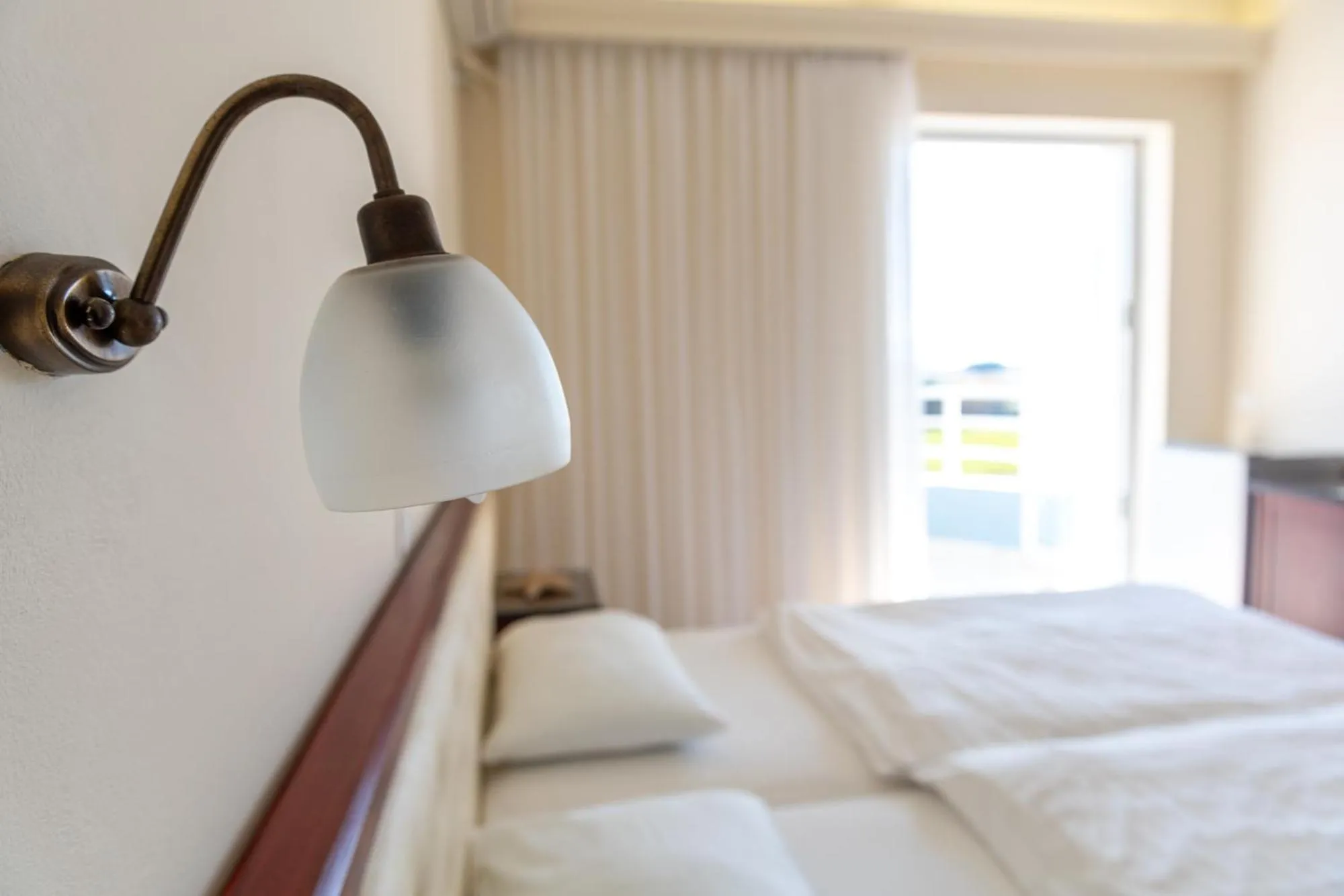 Bed in Dionisos Hotel