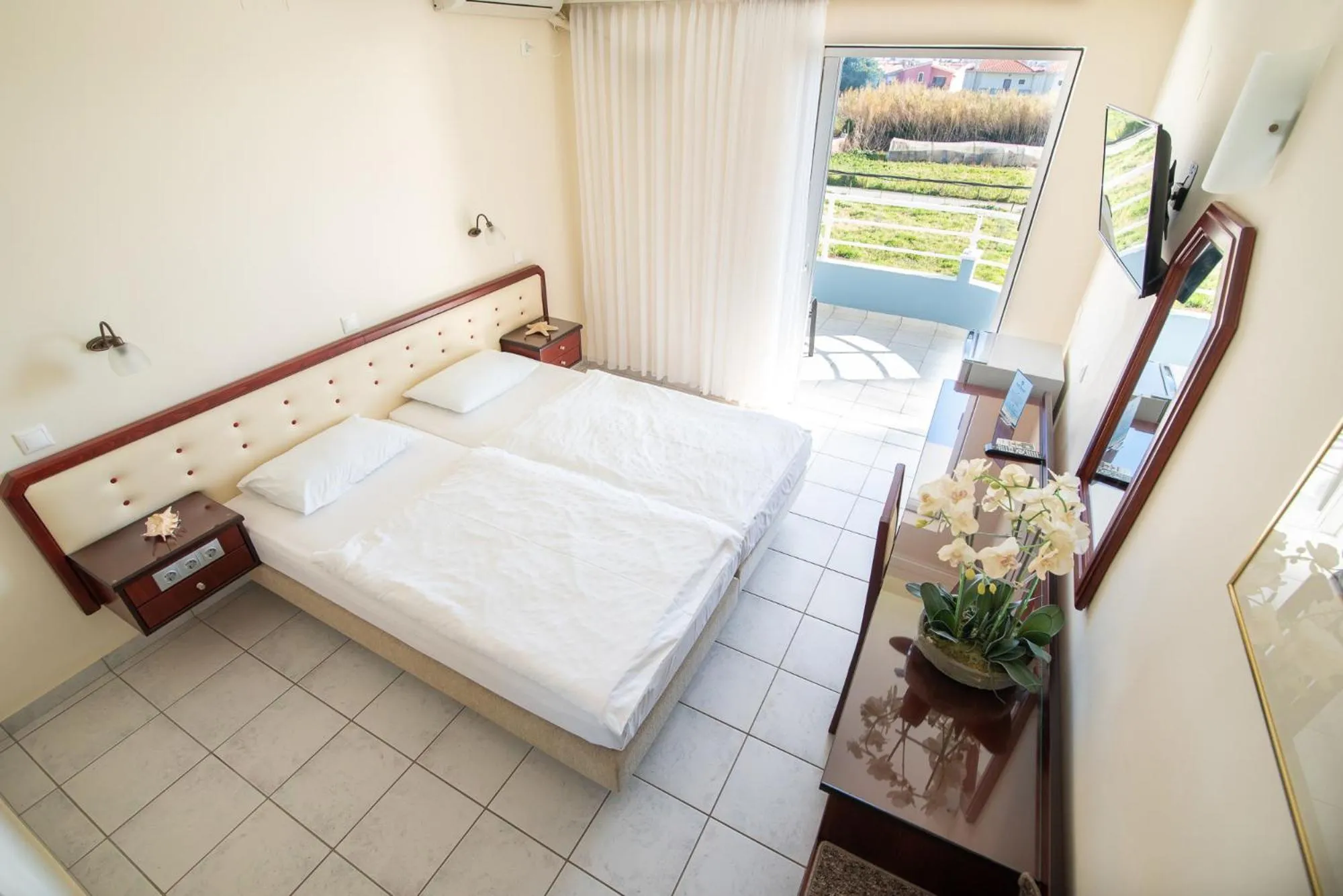 Bed in Dionisos Hotel