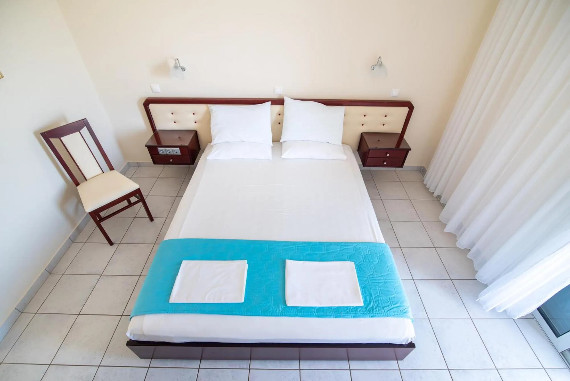 Bed in Dionisos Hotel