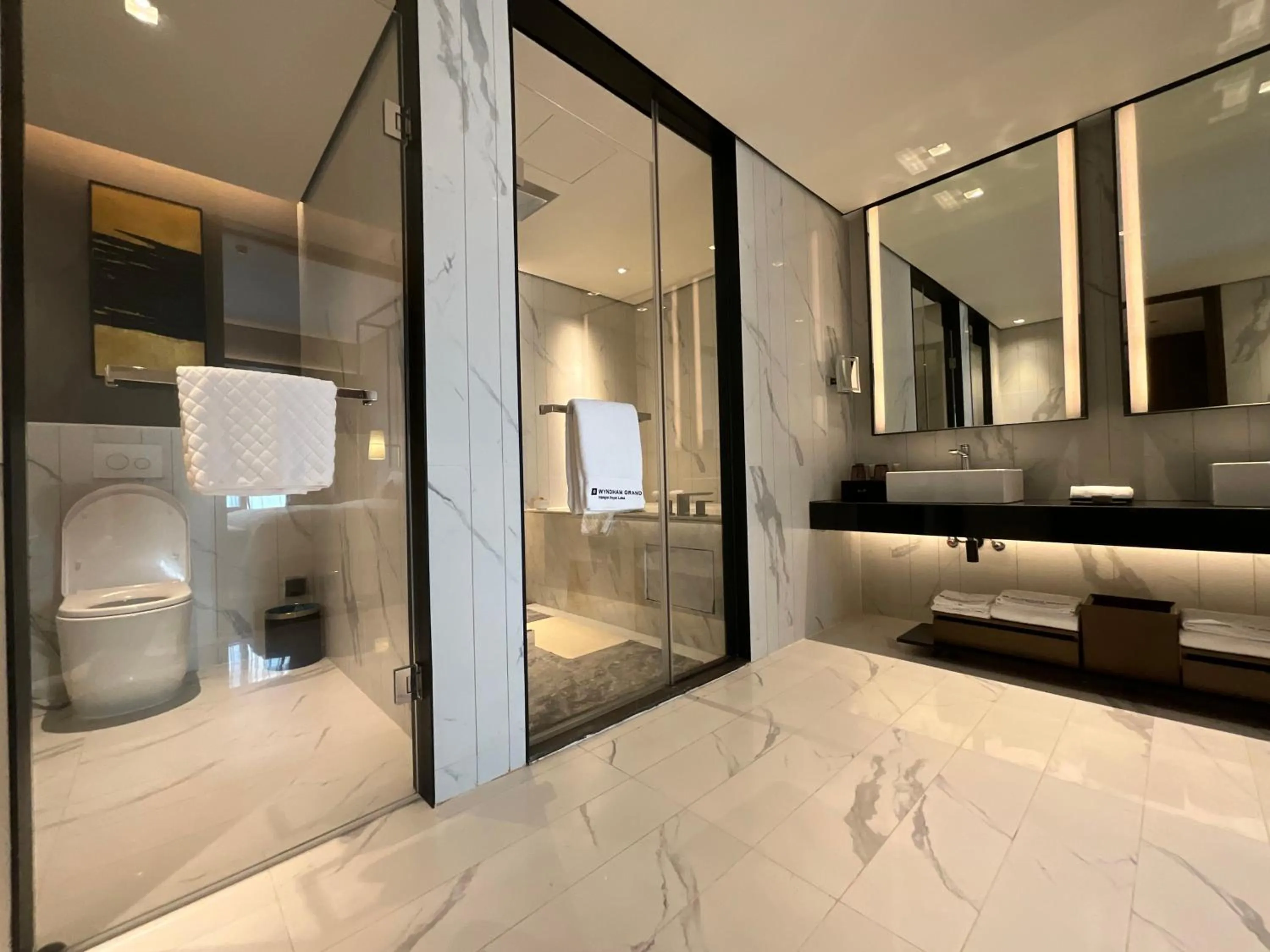 Toilet, Bed in Wyndham Grand Yangon