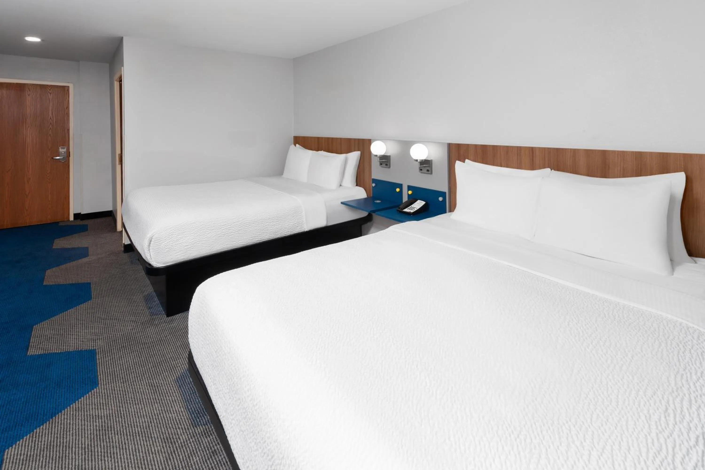 Bed in Microtel Inn by Wyndham Janesville
