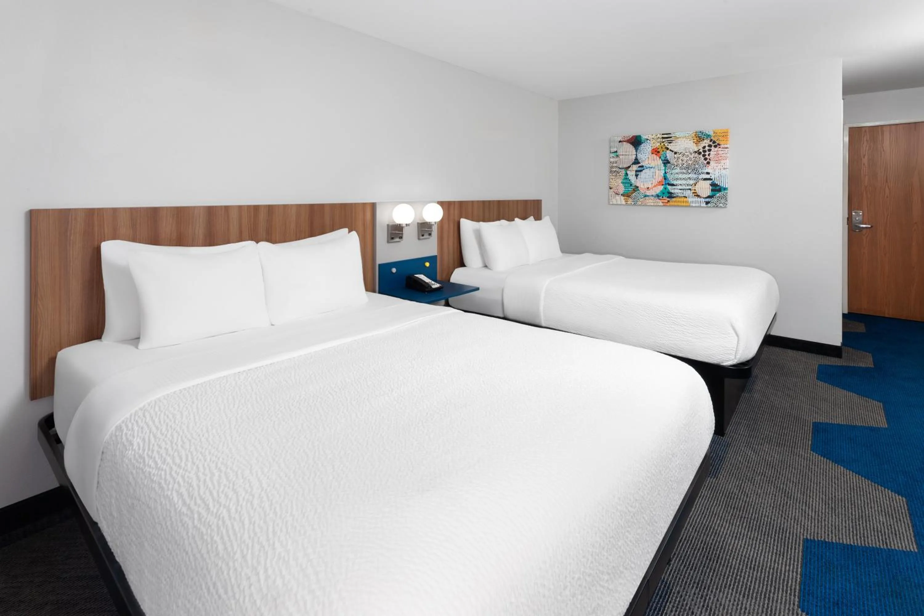 Bed in Microtel Inn by Wyndham Janesville