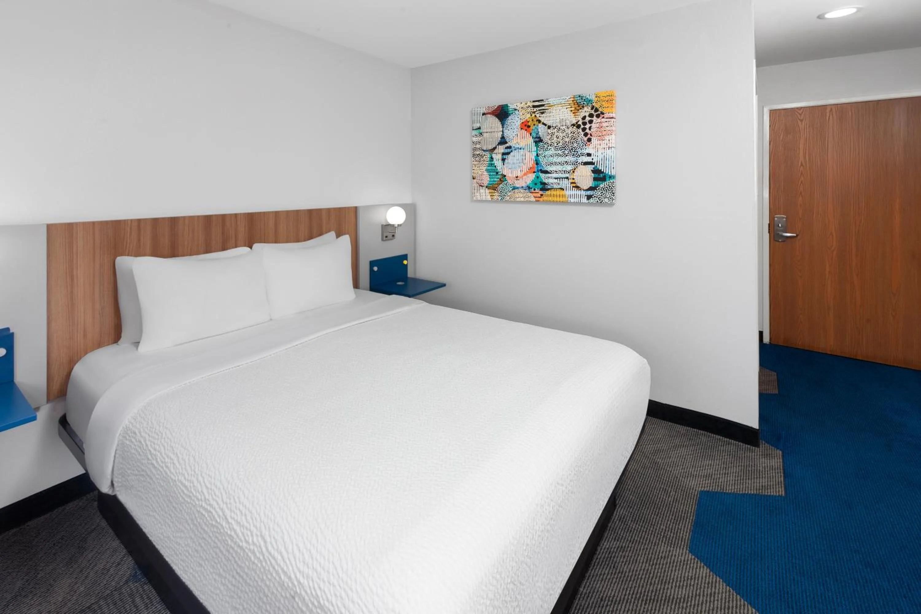 Bed in Microtel Inn by Wyndham Janesville