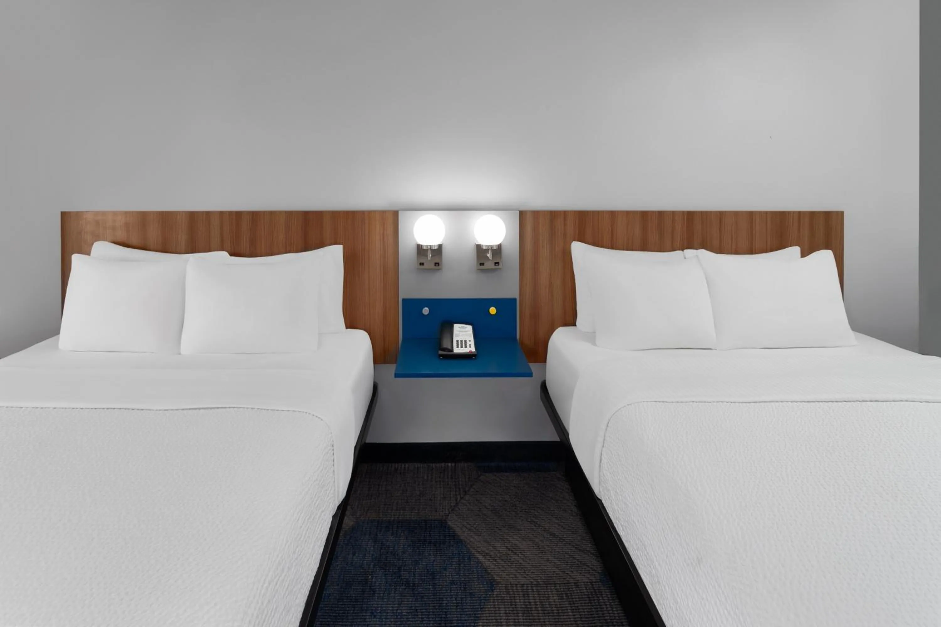 Bed in Microtel Inn by Wyndham Janesville