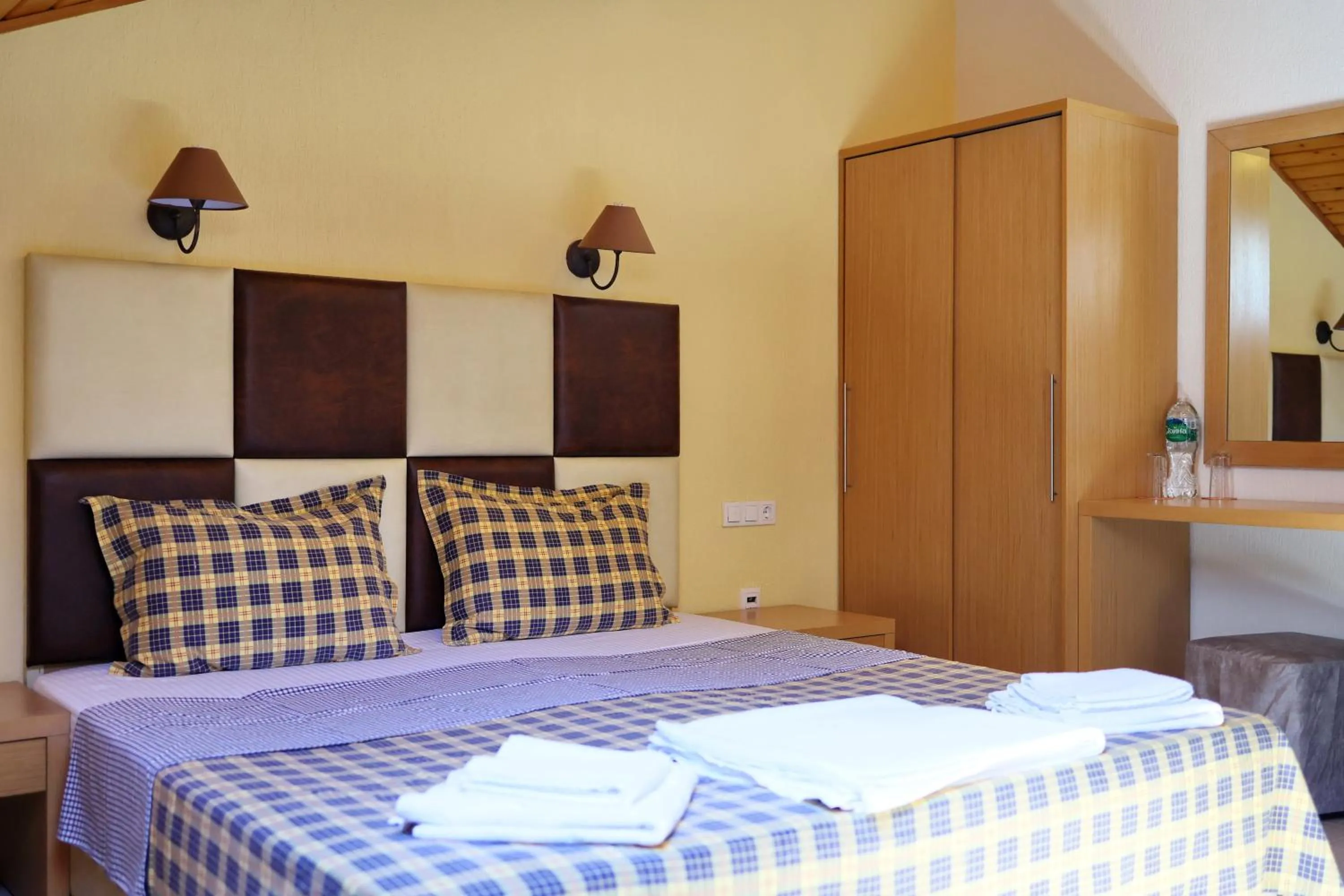 Bed in Elli Greco Hotel