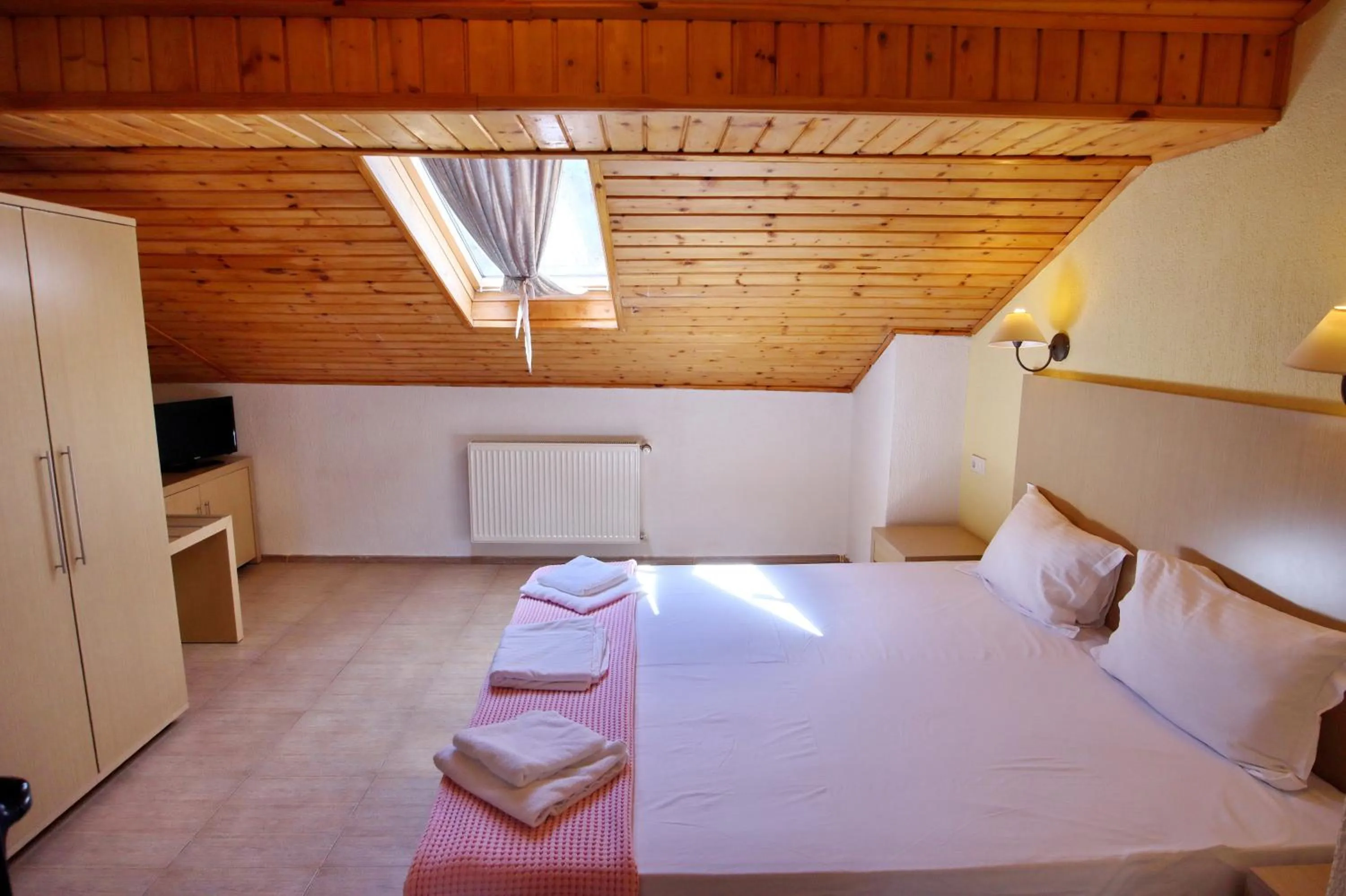 Bed in Elli Greco Hotel