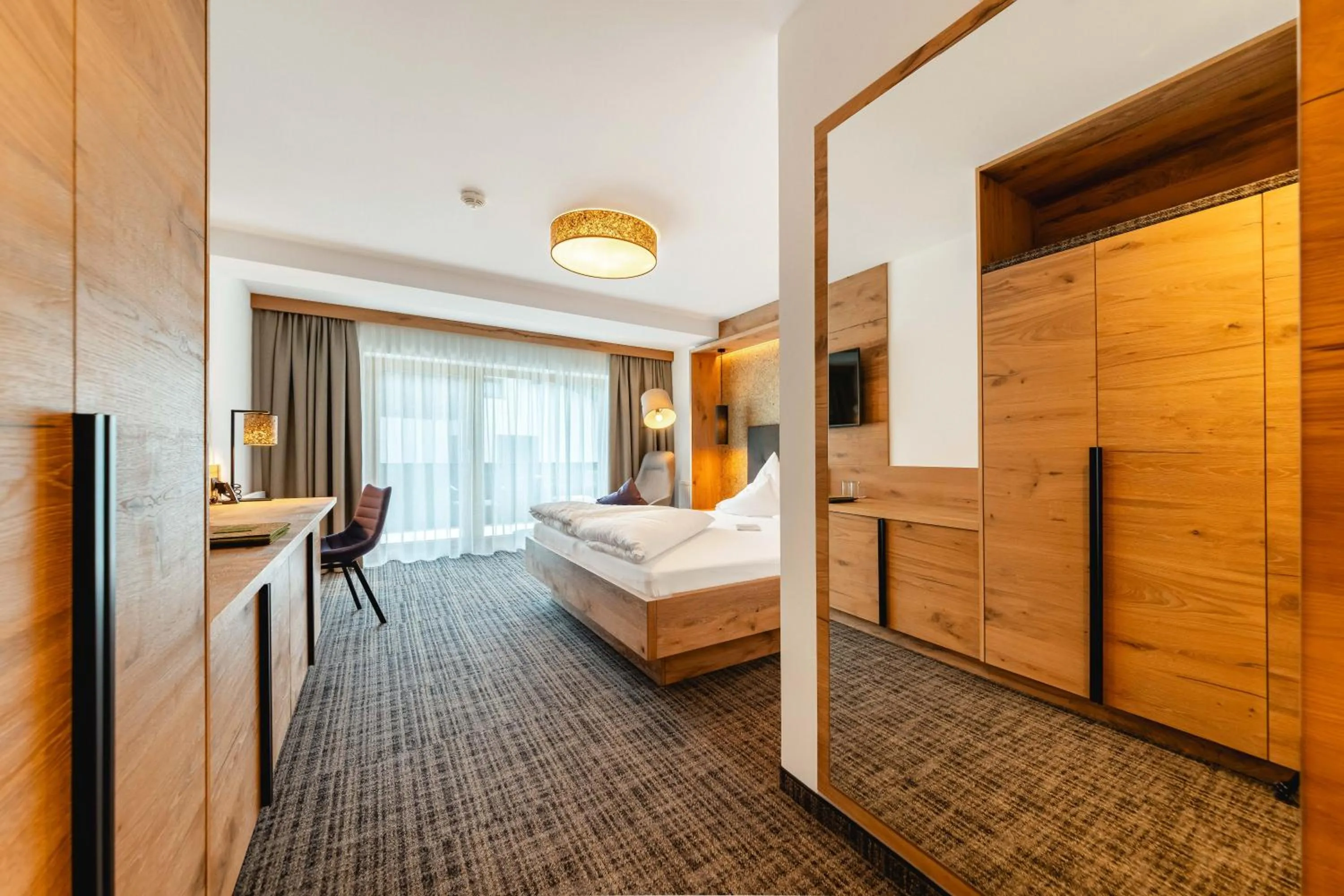 Photo of the whole room, Bed in Kräuterhotel Hochzillertal