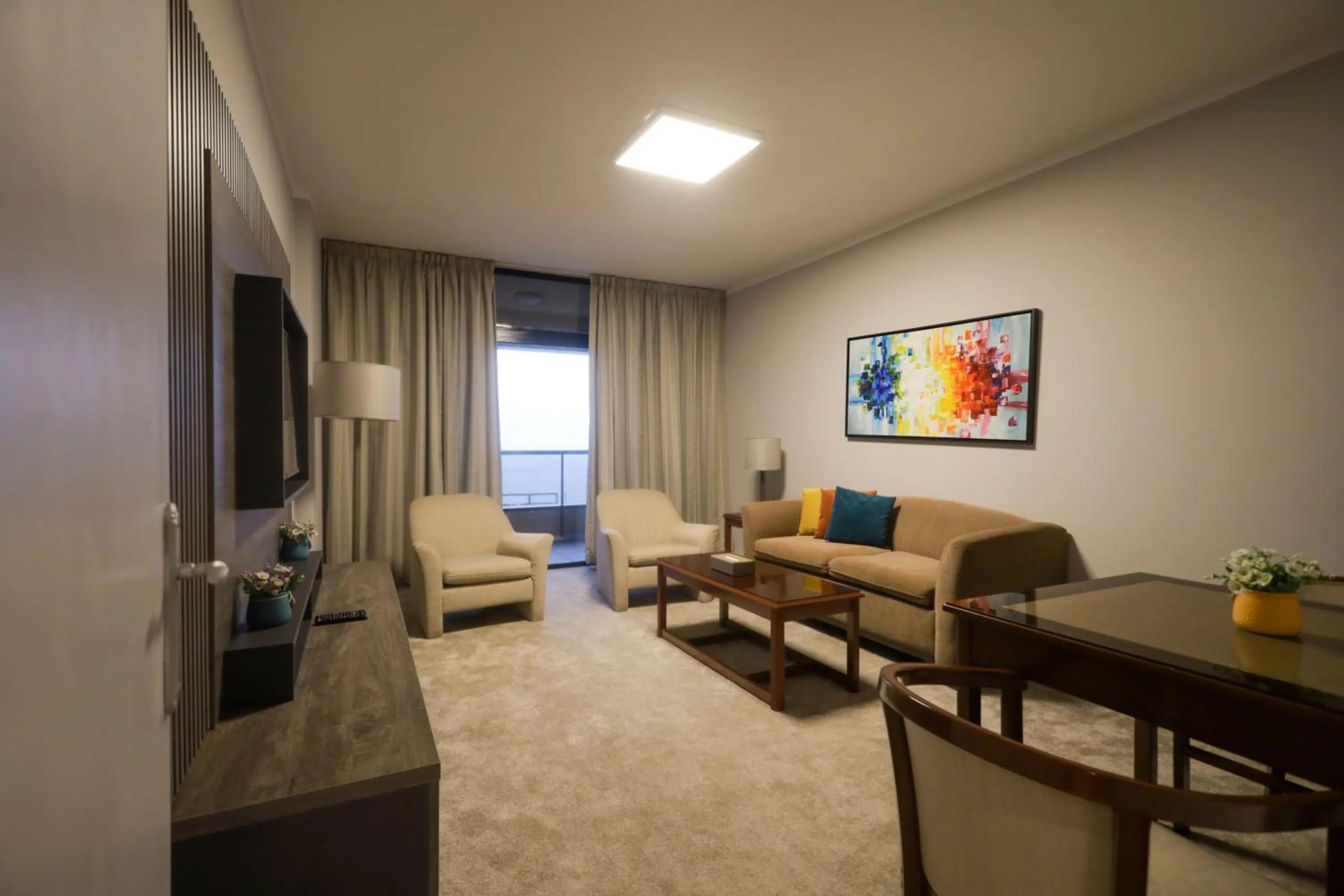 Communal lounge/ TV room in La Vida Suite