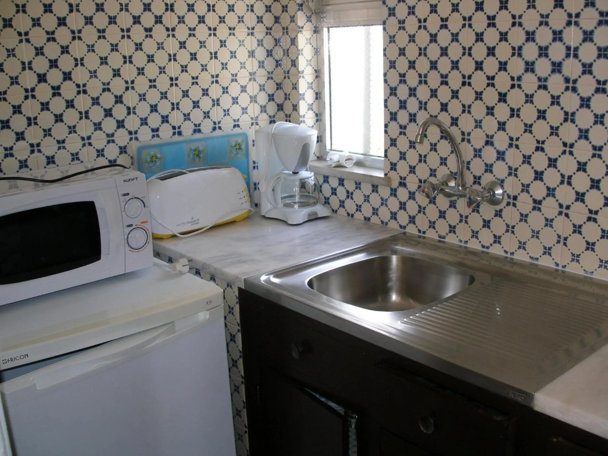 Kitchen or kitchenette in Apartamentos Turisticos Marsol