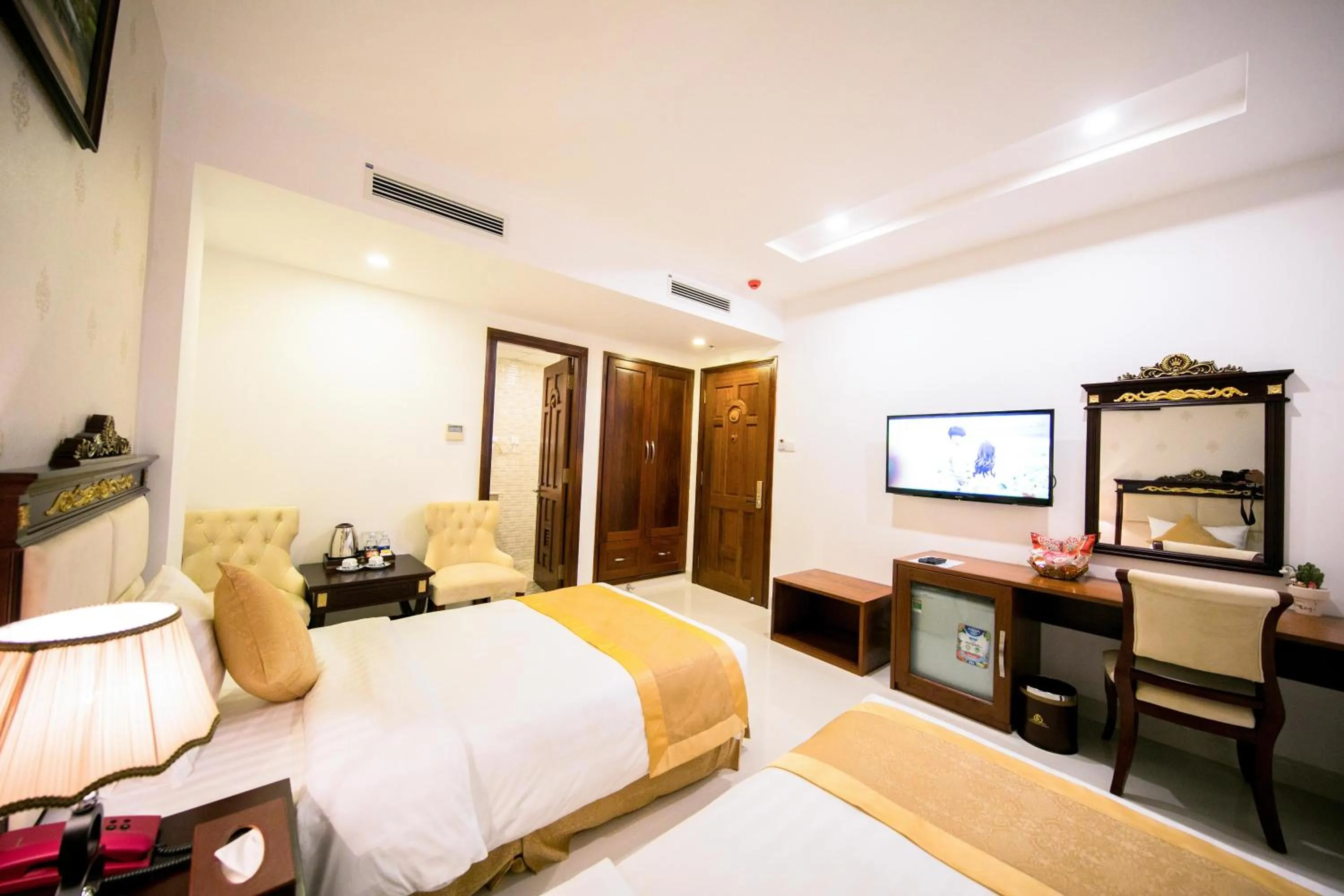 Bed in Le Saigon Hotel