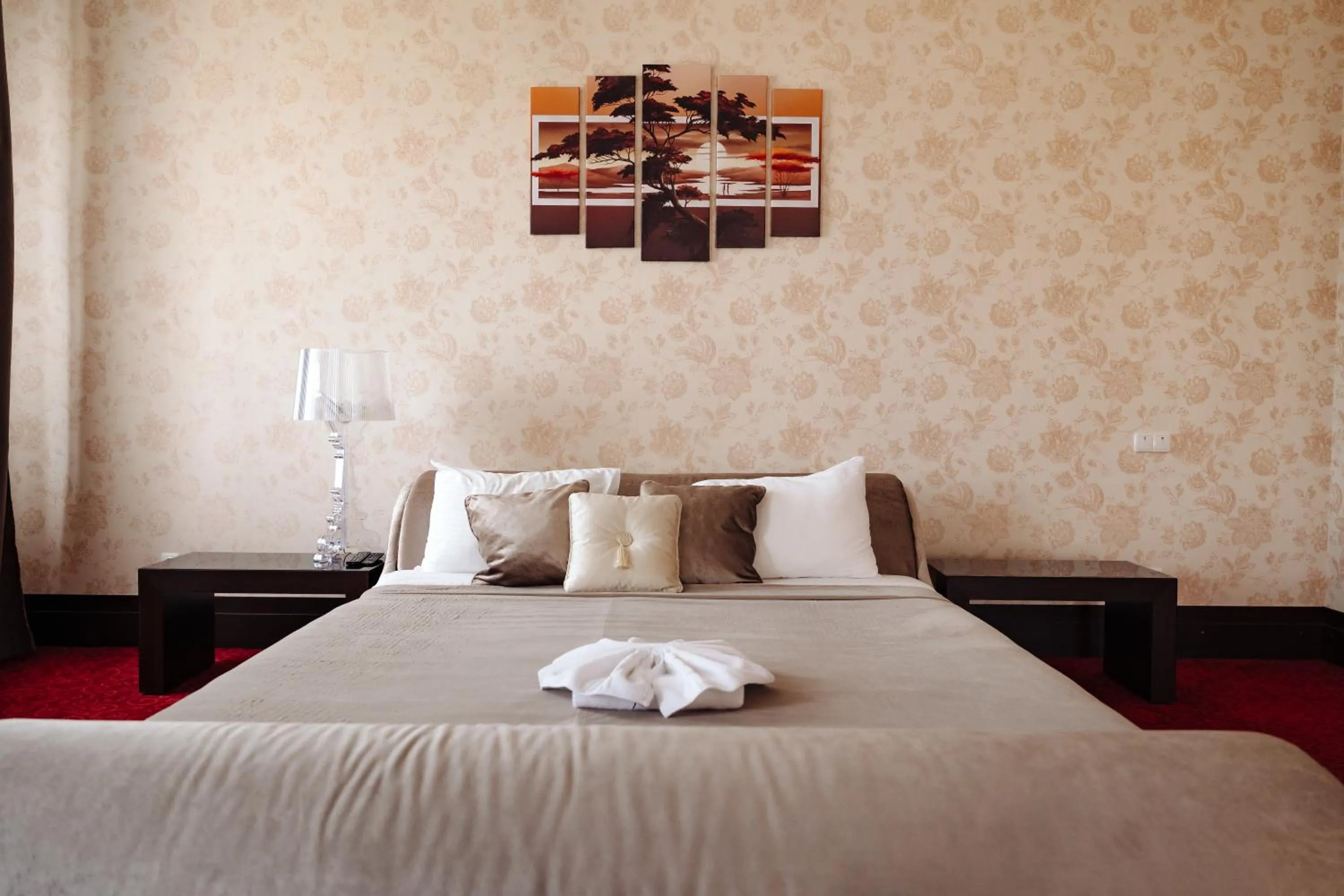 Bed in Maxim Pasha Hotel