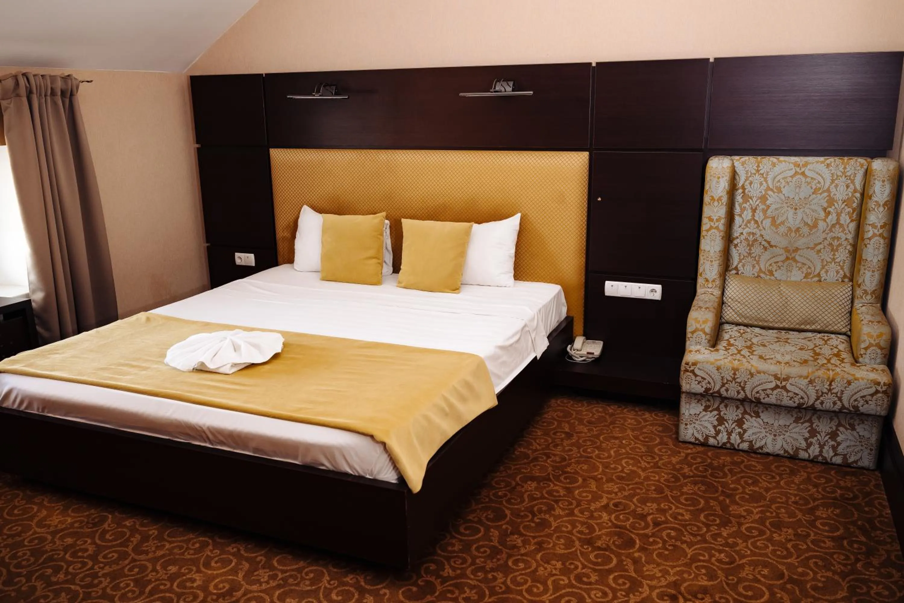 Bed in Maxim Pasha Hotel
