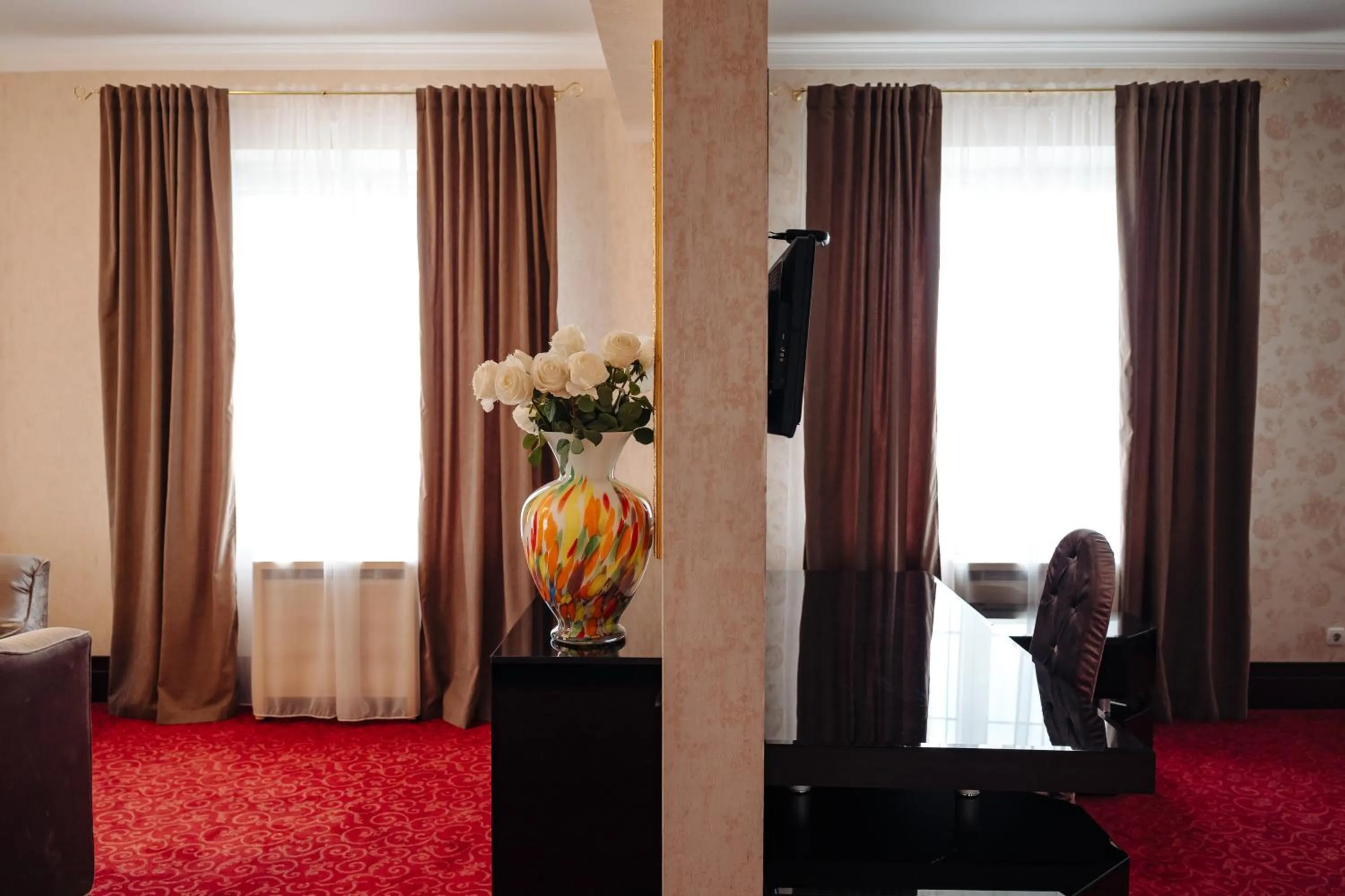 Bed in Maxim Pasha Hotel