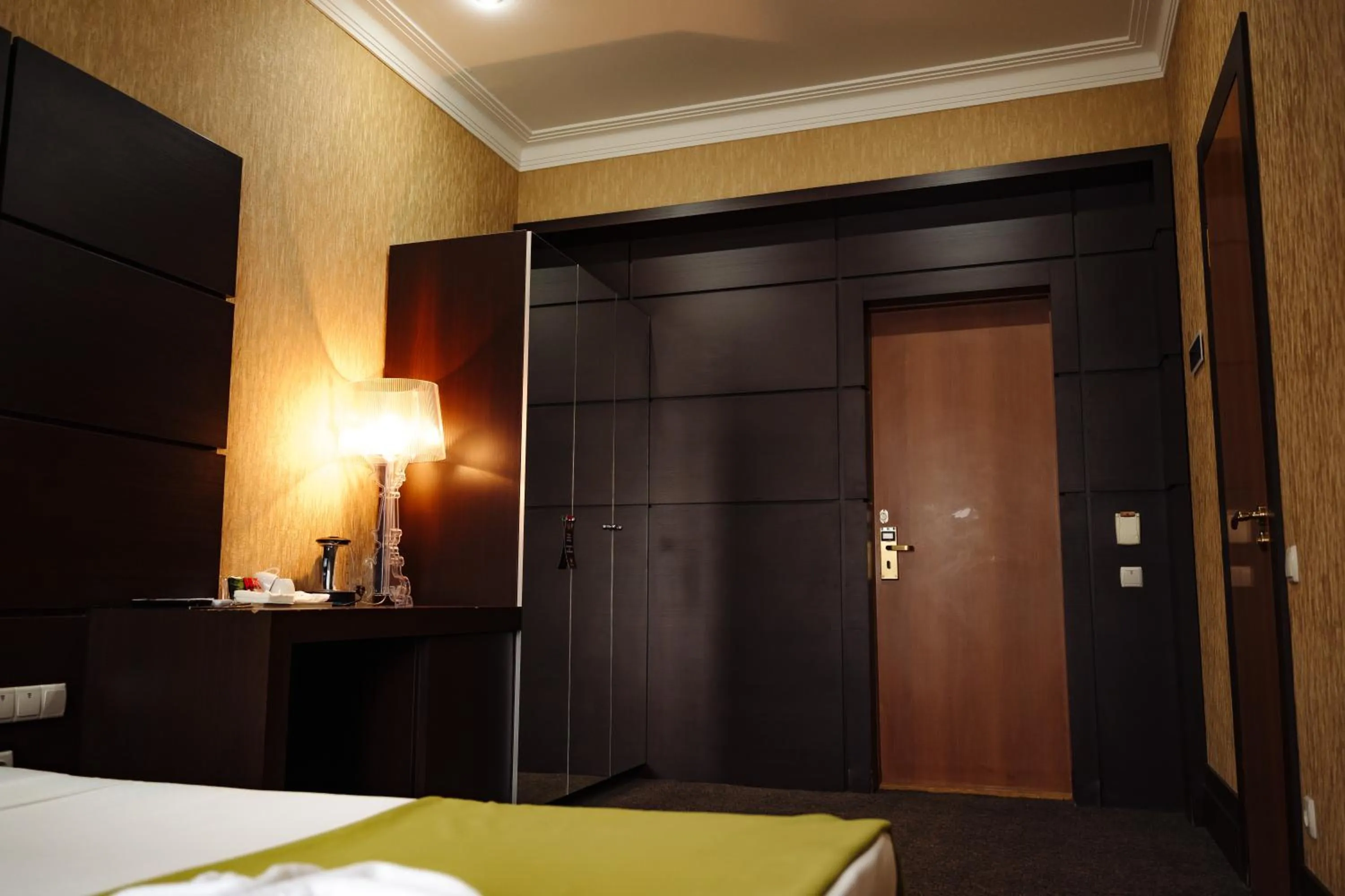 Bed in Maxim Pasha Hotel