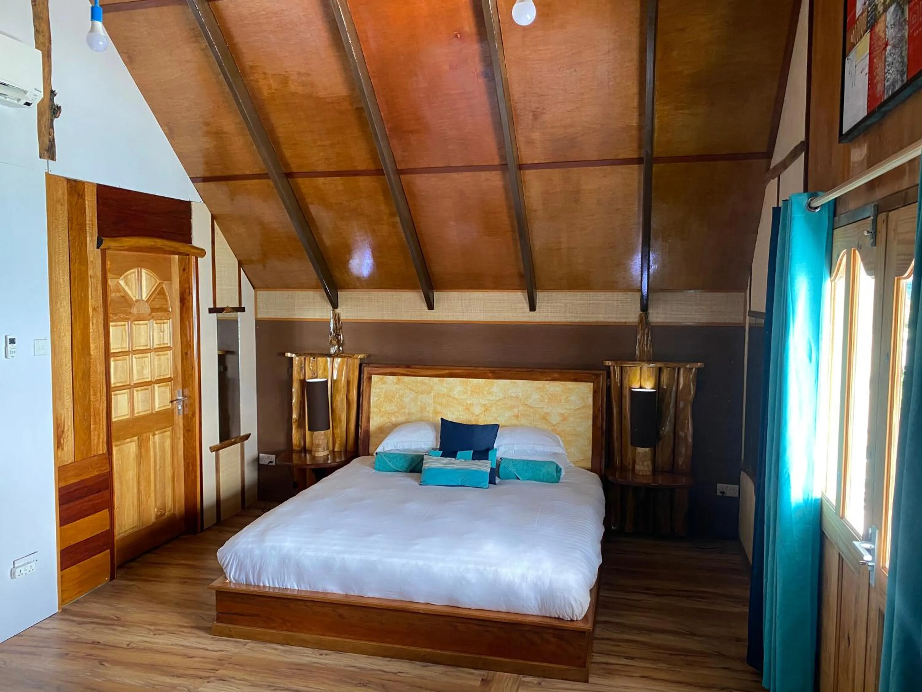 Bed in Mouggae Blues Villas