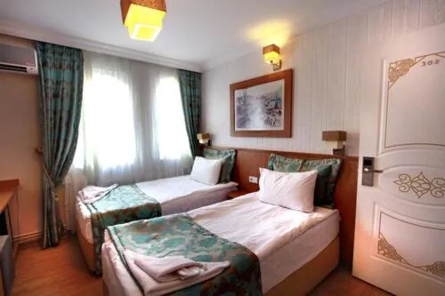 Bed in Agora Boutique Hotel & Bistro