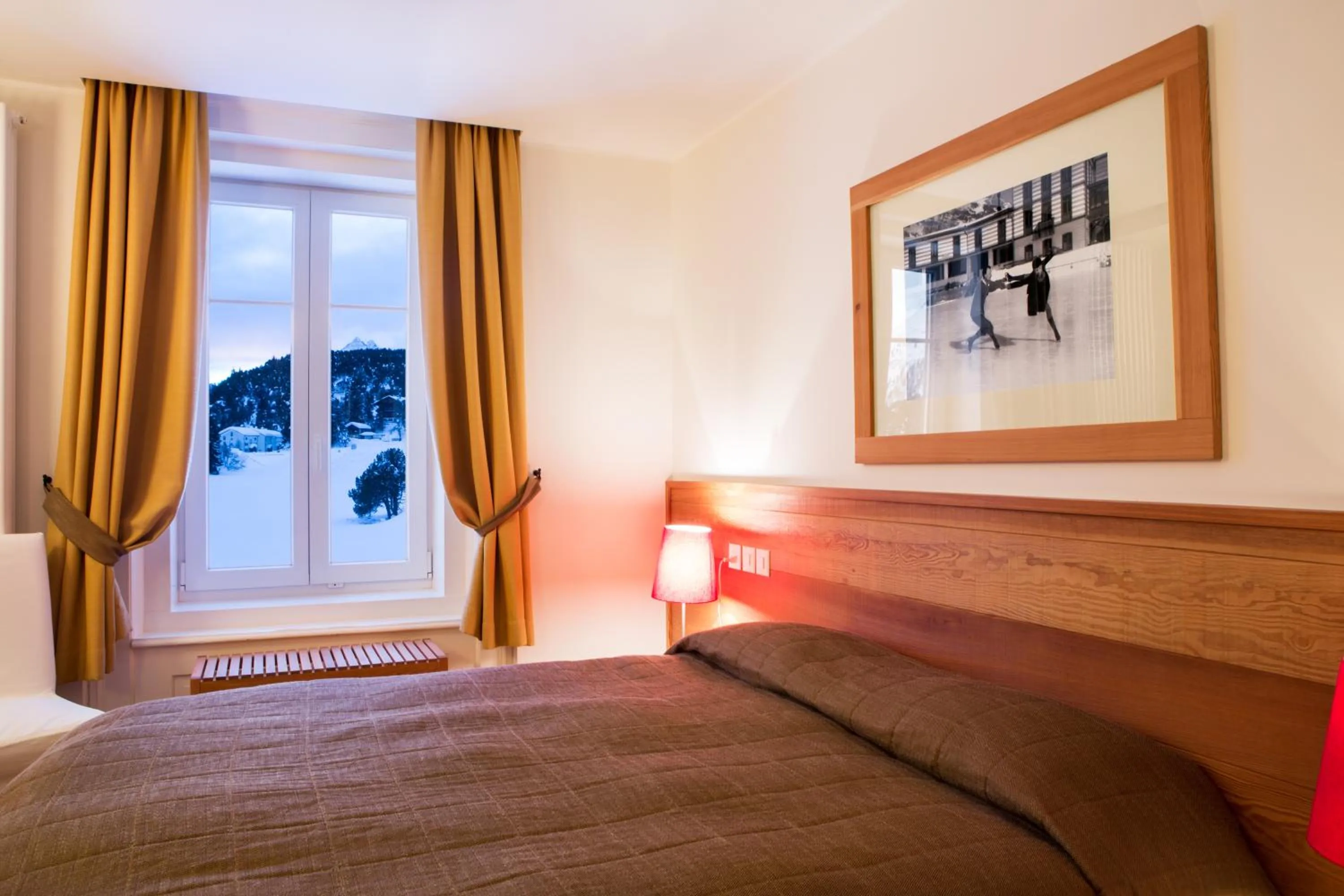 Bed in Maloja Palace Suites CO2-Neutral