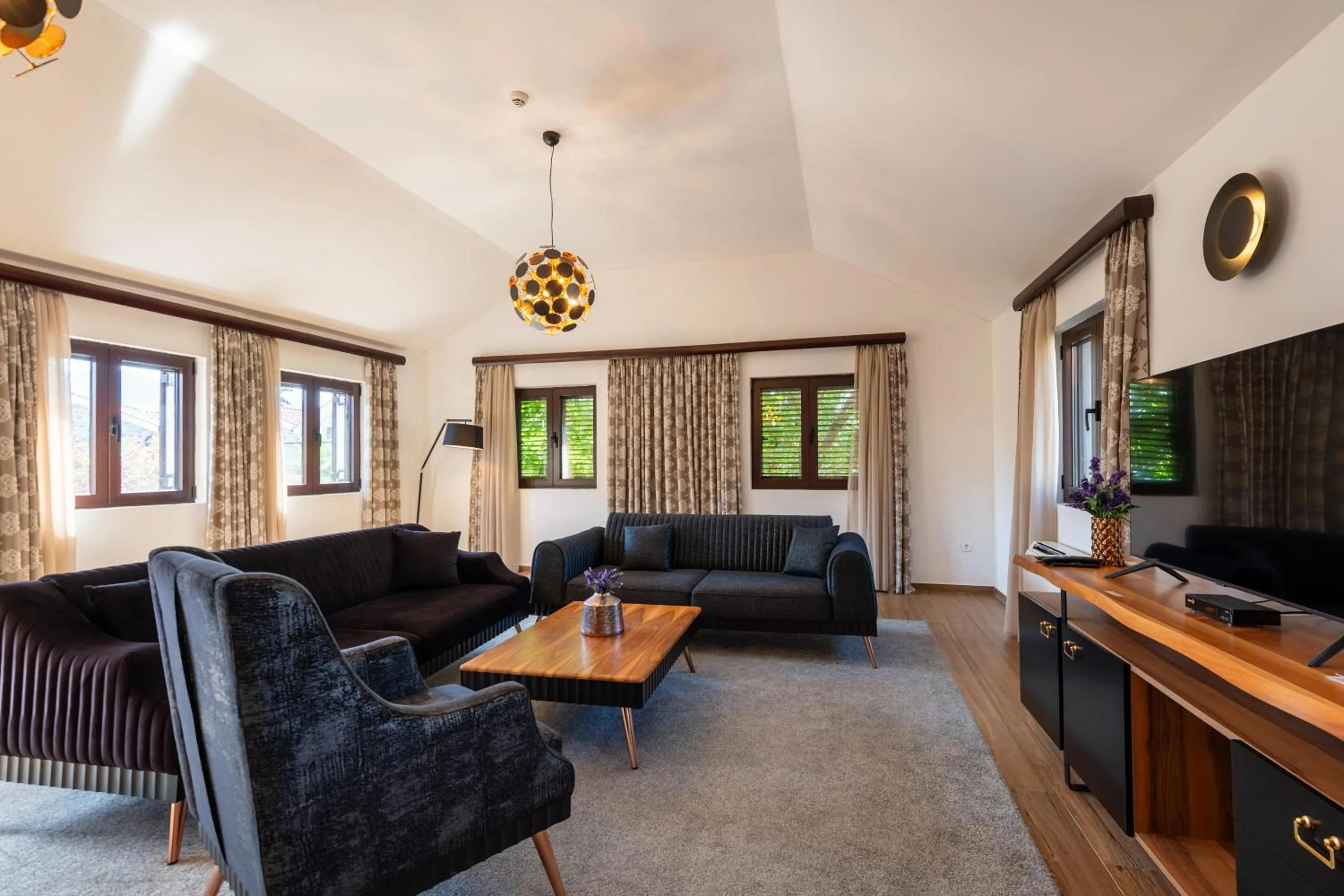 Communal lounge/ TV room in Forte Rose Hotel