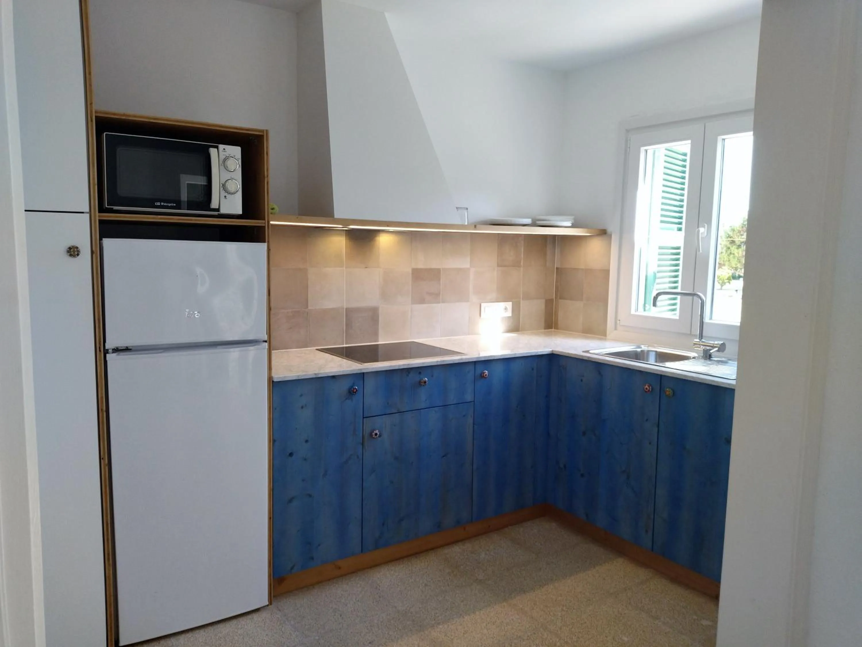 kitchen in Nure Cel Blau