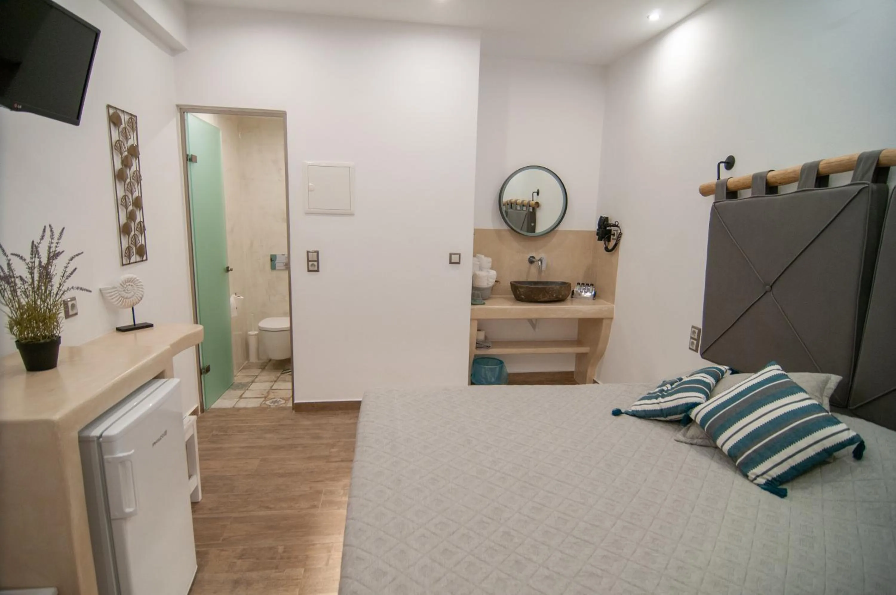 Bed in Katerina Roza Studios - Heartfelt Hospitality in the City