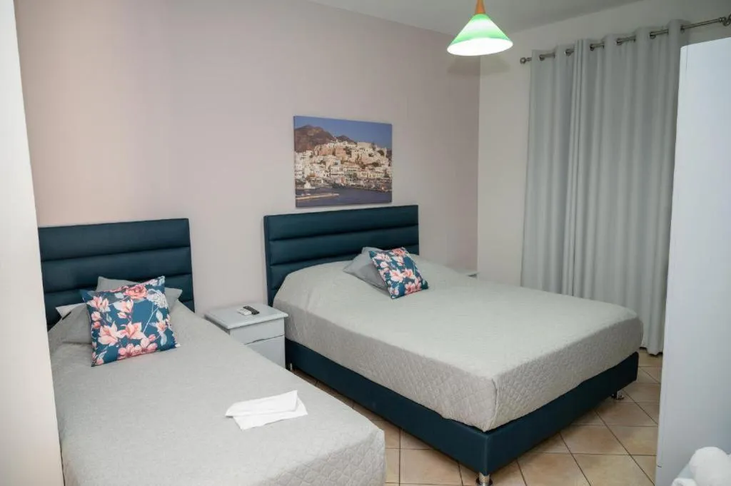 Bed in Katerina Roza Studios - Heartfelt Hospitality in the City