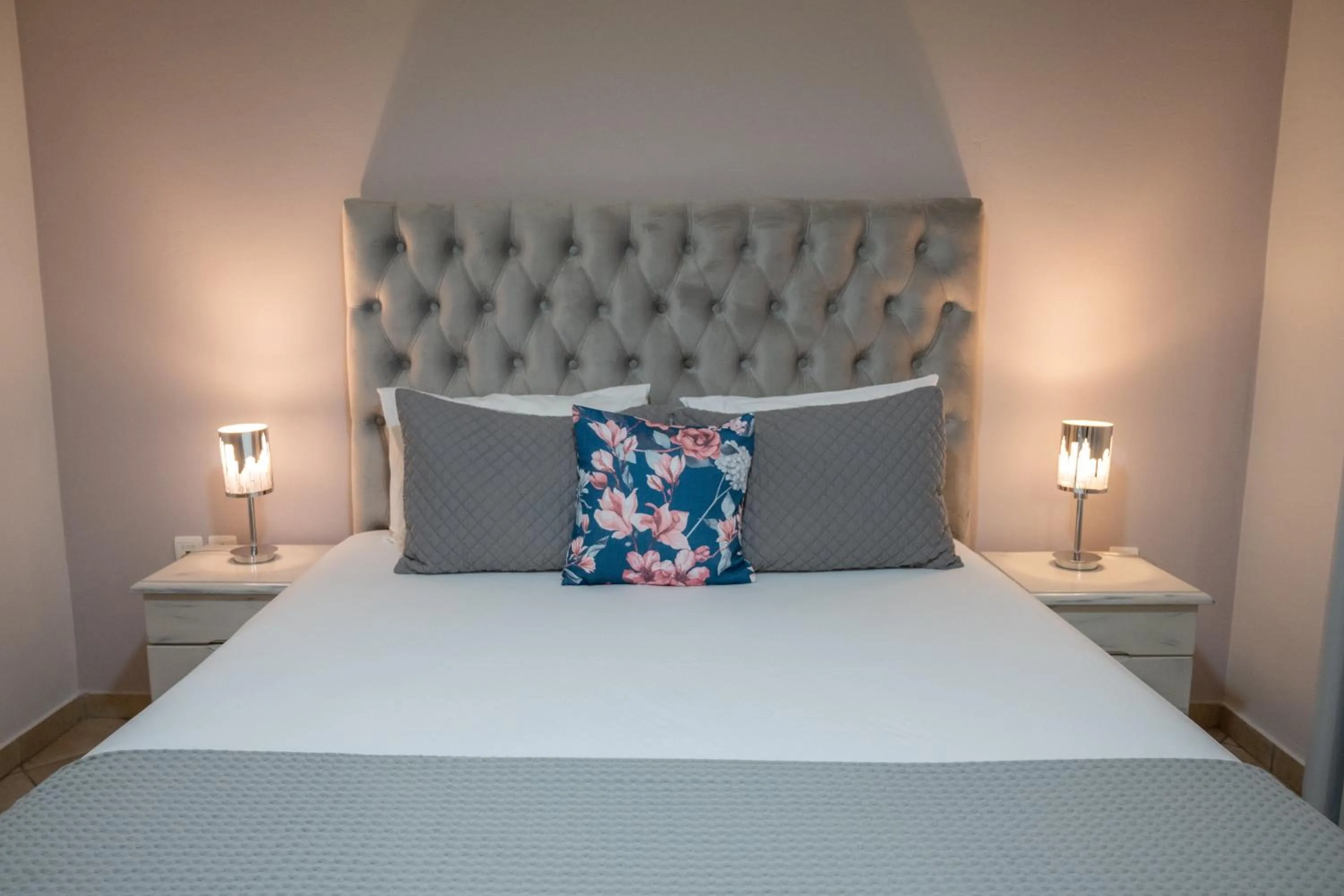 Bed in Katerina Roza Studios - Heartfelt Hospitality in the City