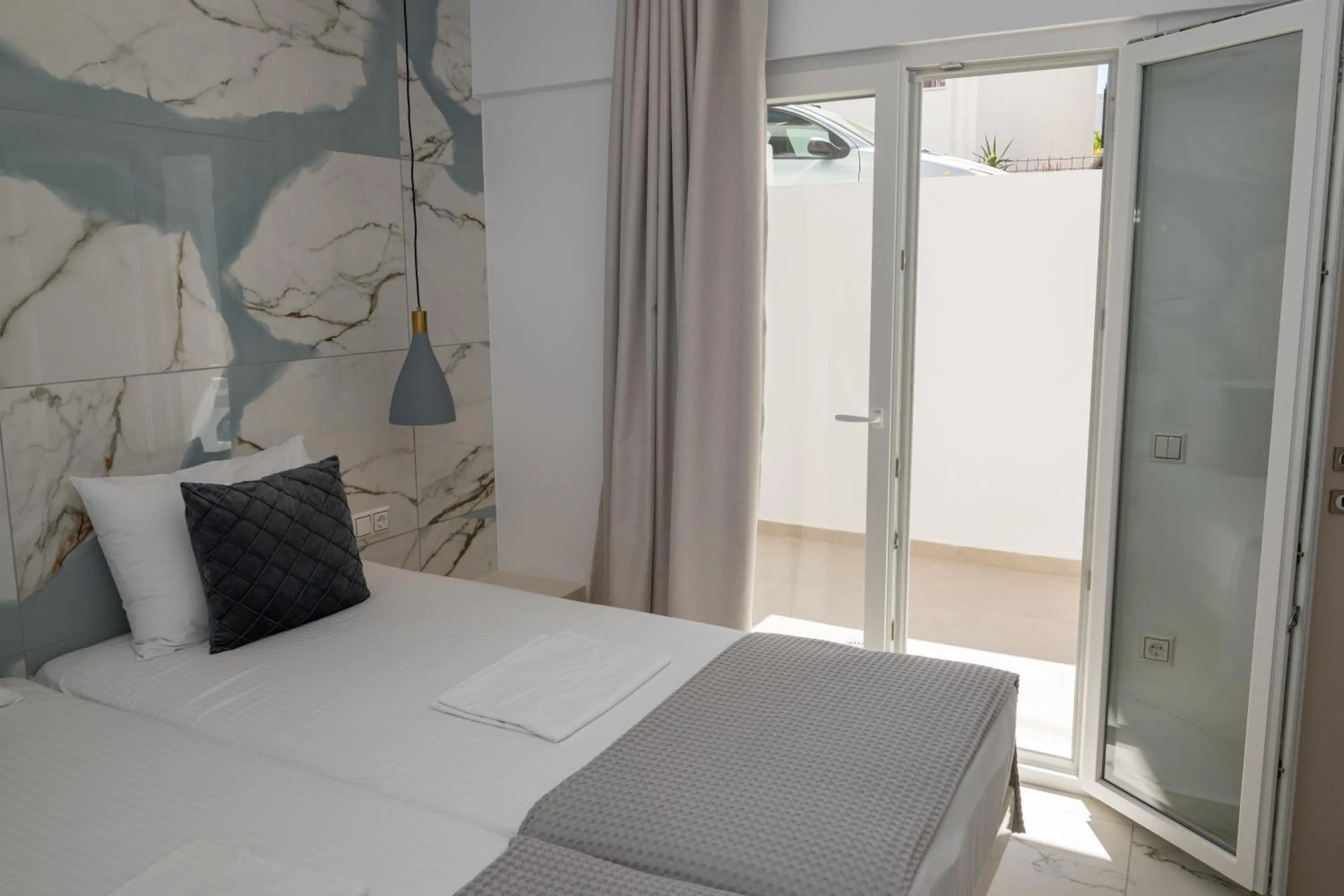 Bed in Katerina Roza Studios - Heartfelt Hospitality in the City