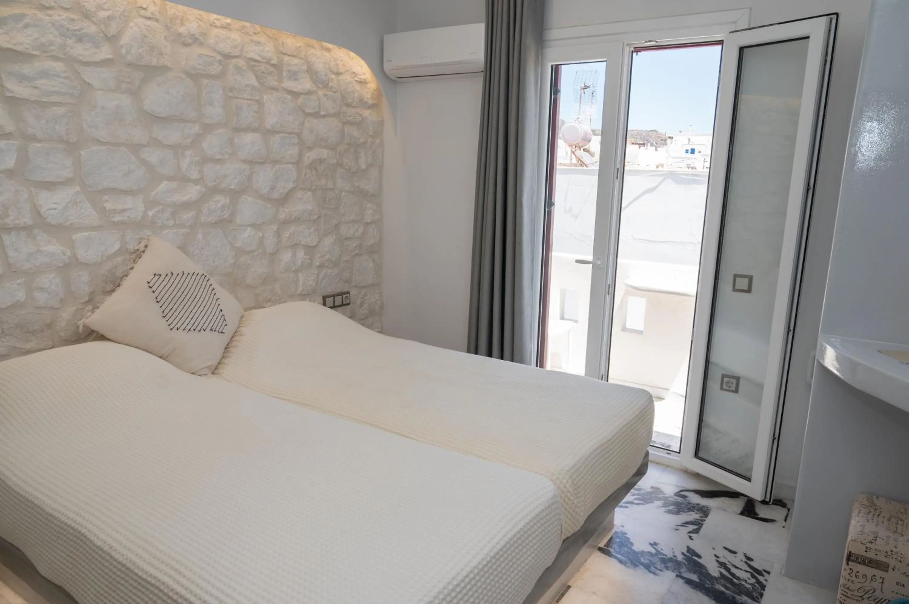 Bed in Katerina Roza Studios - Heartfelt Hospitality in the City
