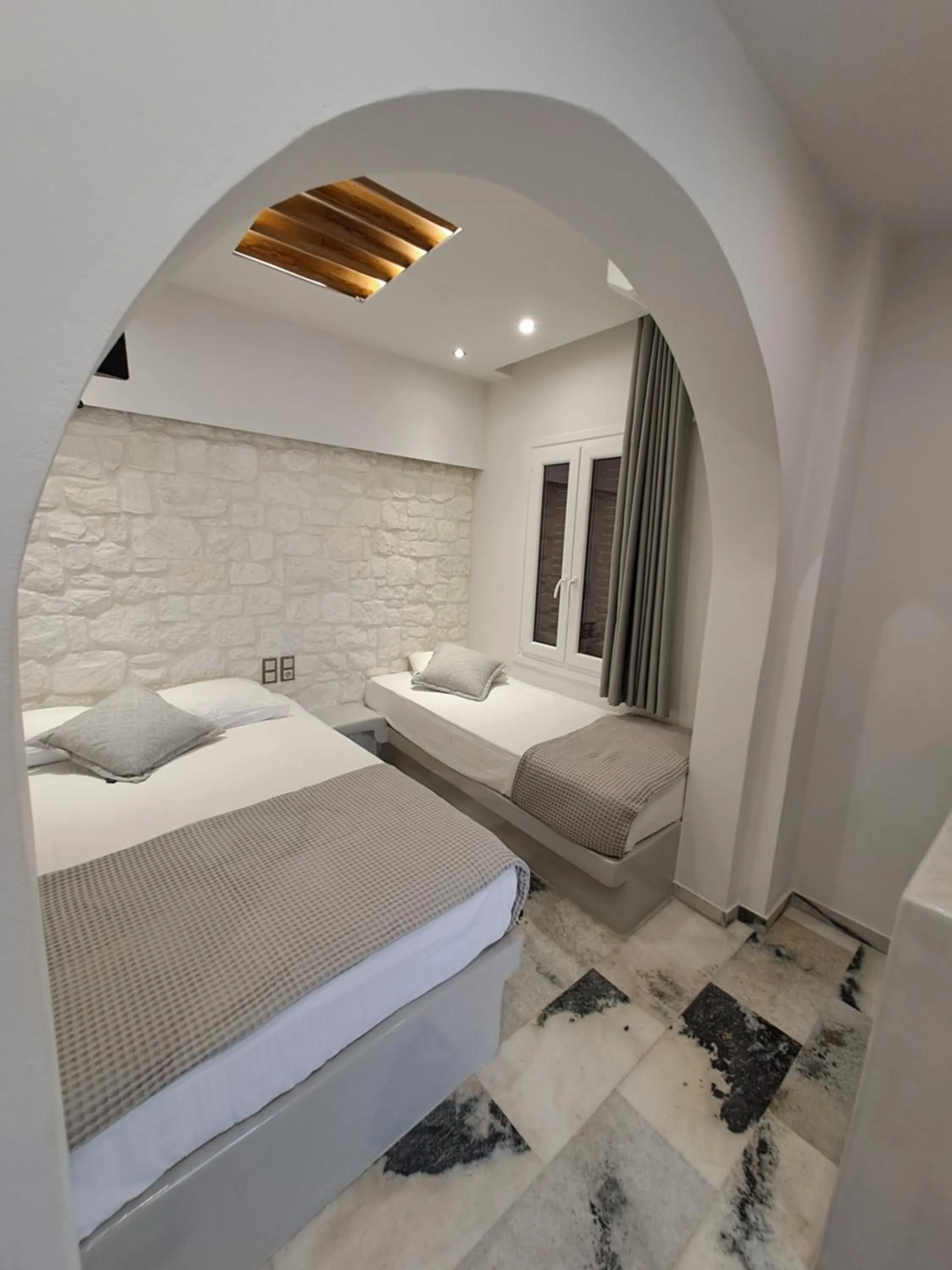 Bed in Katerina Roza Studios - Heartfelt Hospitality in the City