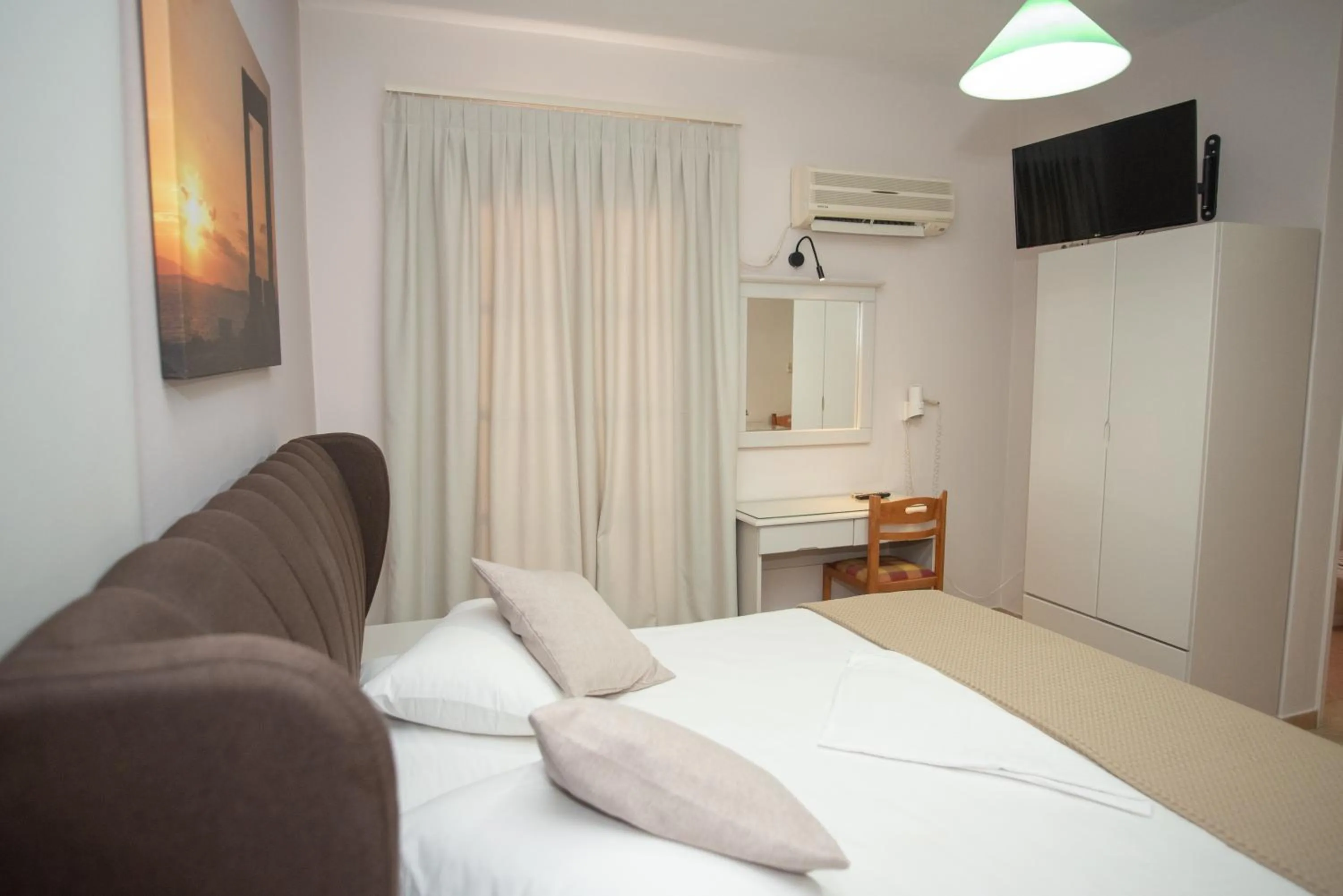 Bed in Katerina Roza Studios - Heartfelt Hospitality in the City