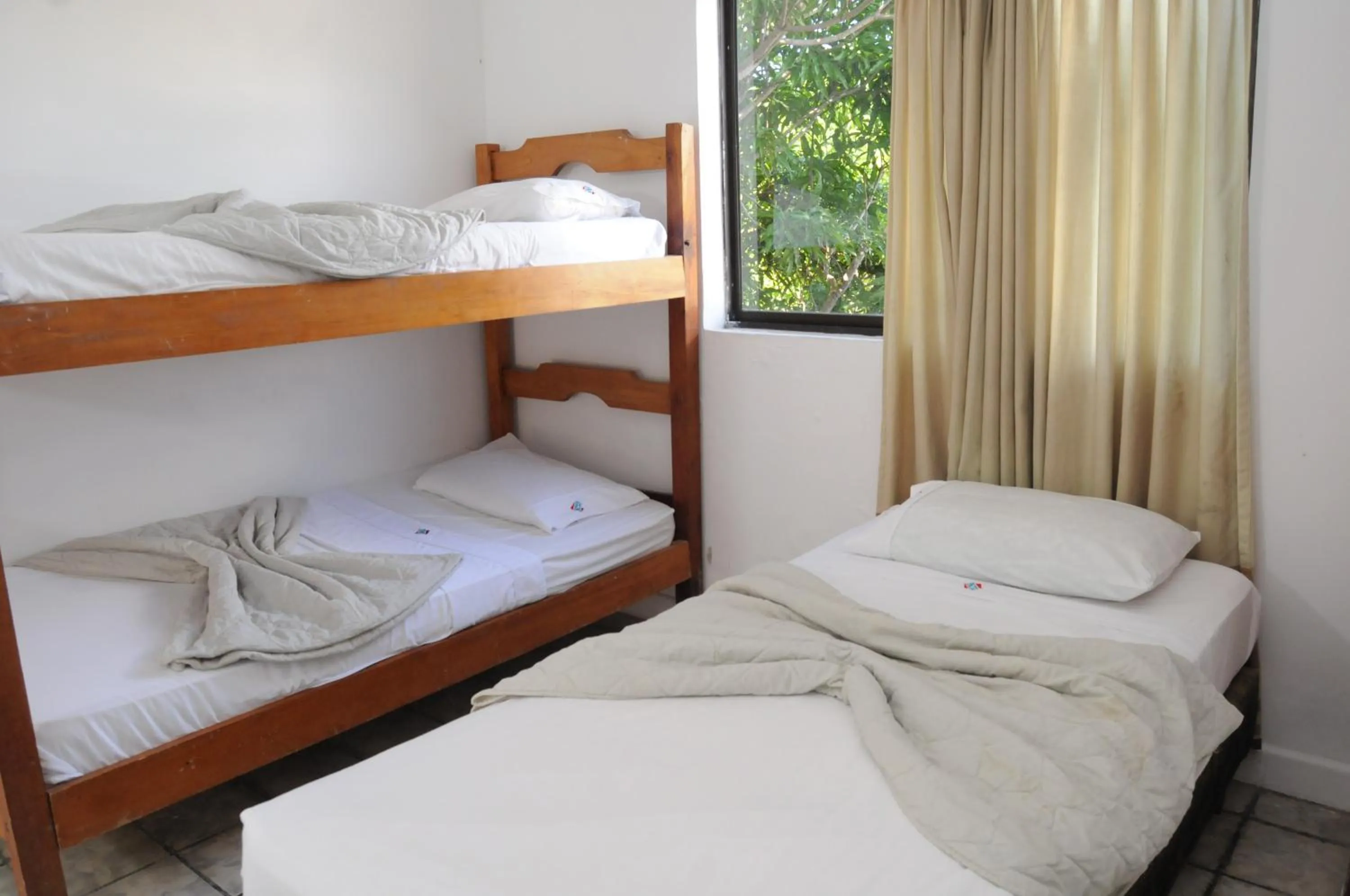 Bed in Hotel Montecarlo Beach