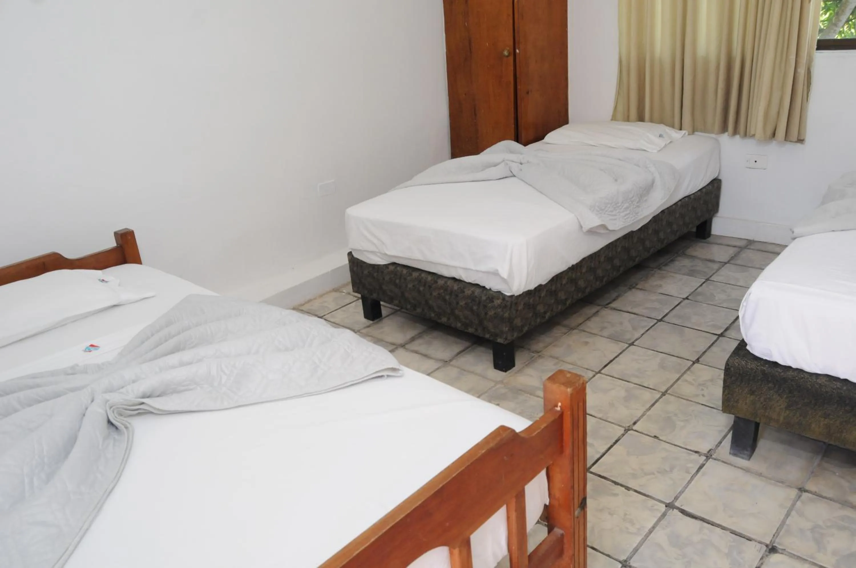 Bed in Hotel Montecarlo Beach