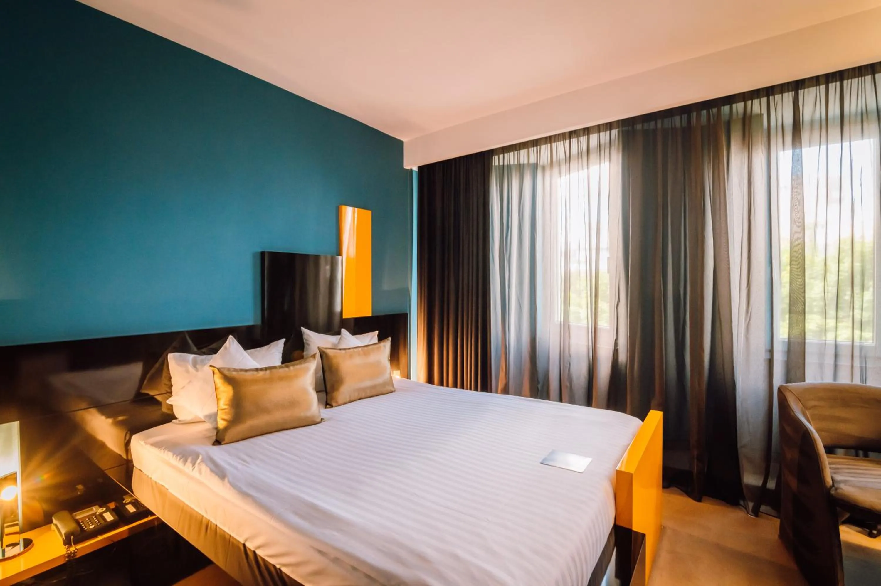 Bed in Plaza V Hotel