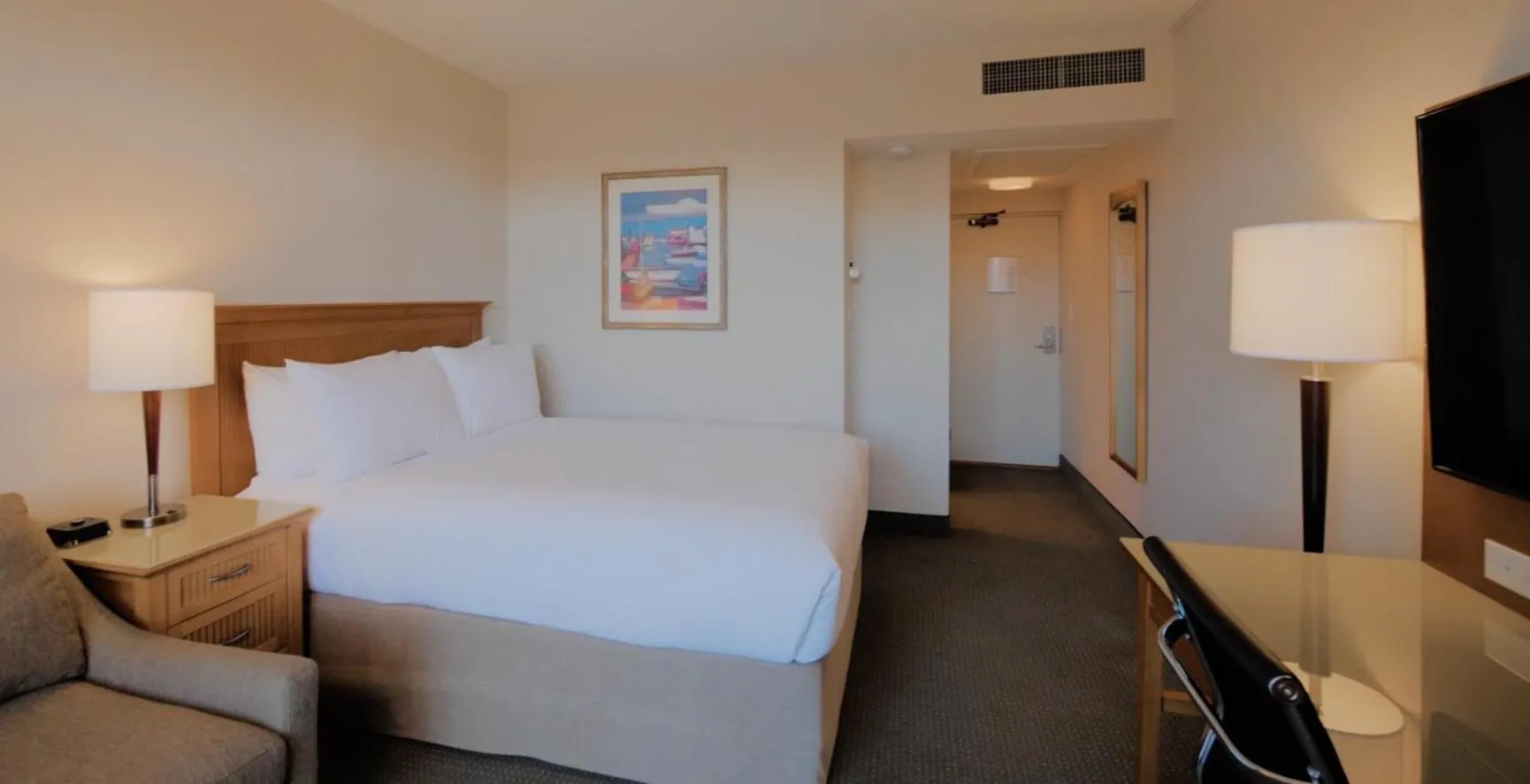 Communal lounge/ TV room, Bed in Coast Capri Hotel