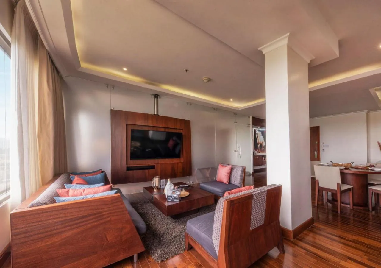 Living room, Bed in Hillary Nature Resort & Spa All Inclusive