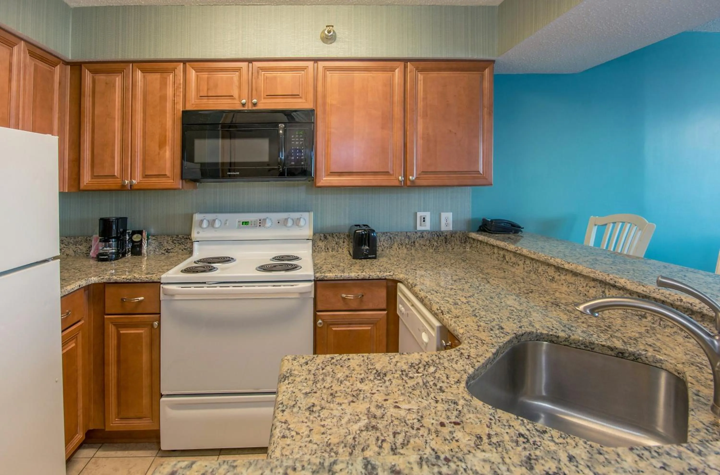 Kitchen or kitchenette in The Strand - A Boutique Resort