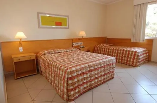 Bed in Jaguary Hotel Sumaré