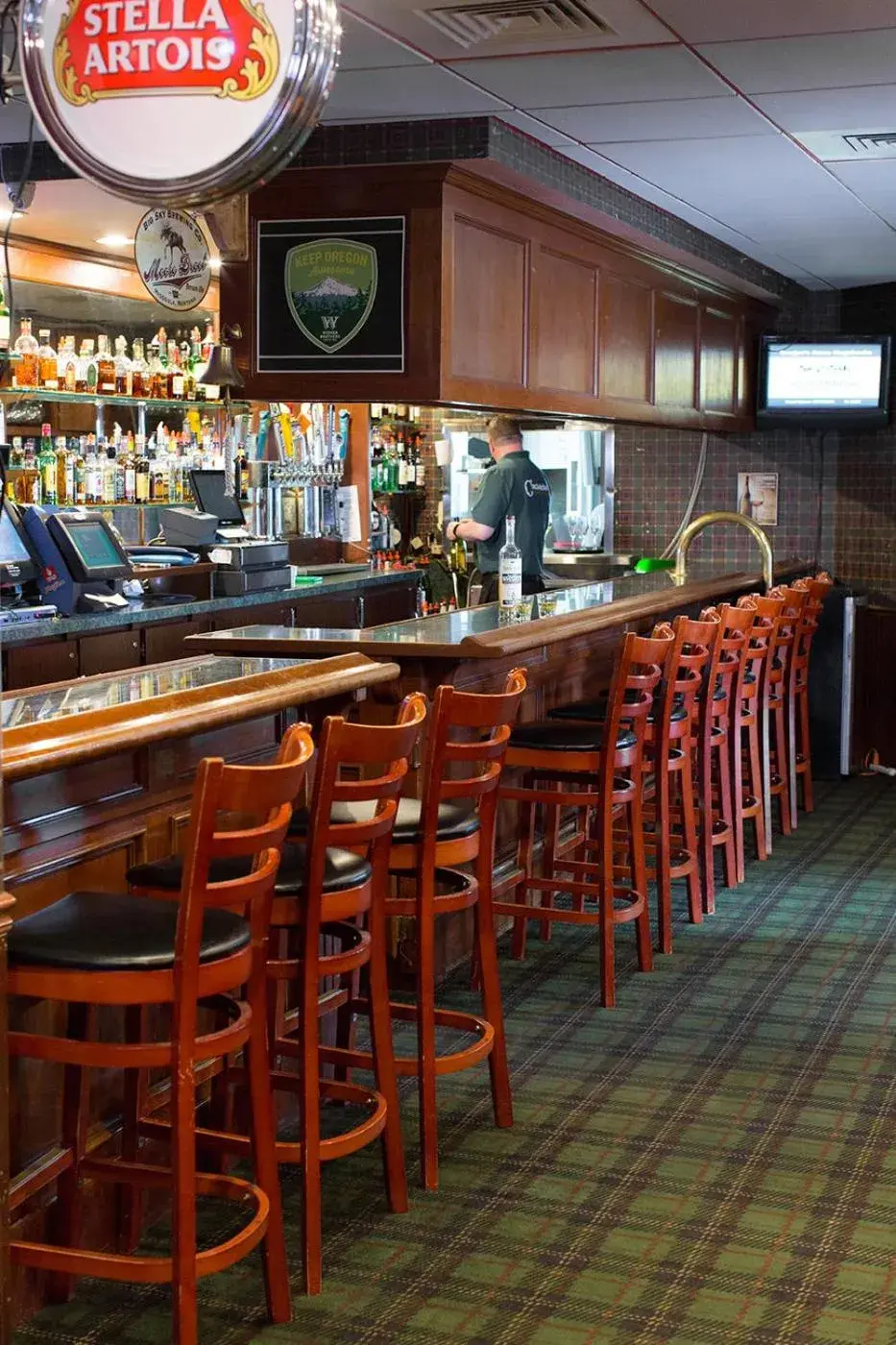 Lounge or bar in Rogue Regency Inn & Suites Lounge or bar in Rogue Regency Inn & Suites