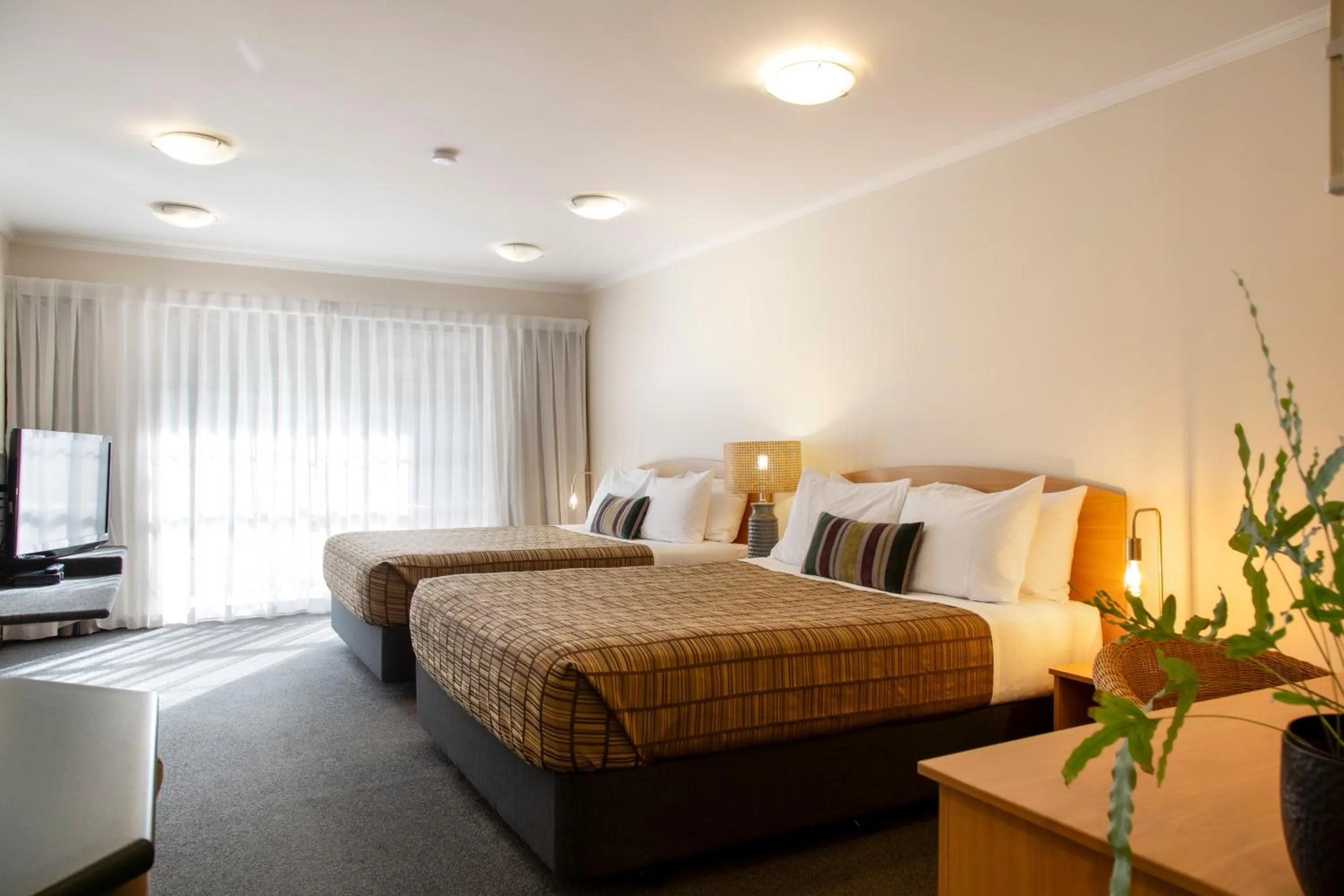 Bed in Greenlane Manor Motel