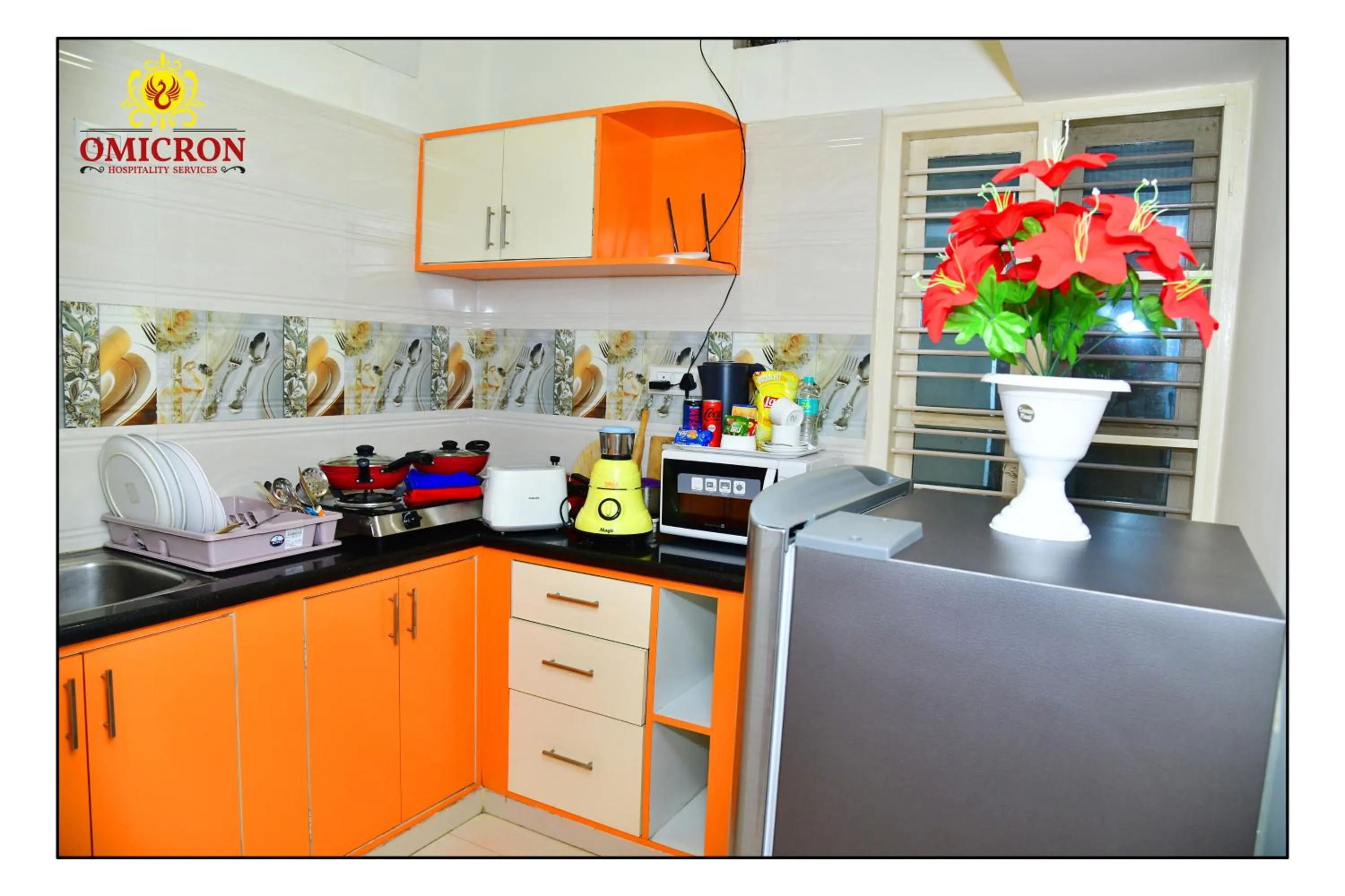 Kitchen or kitchenette in Hotel Omicron 1 BHK Studio room
