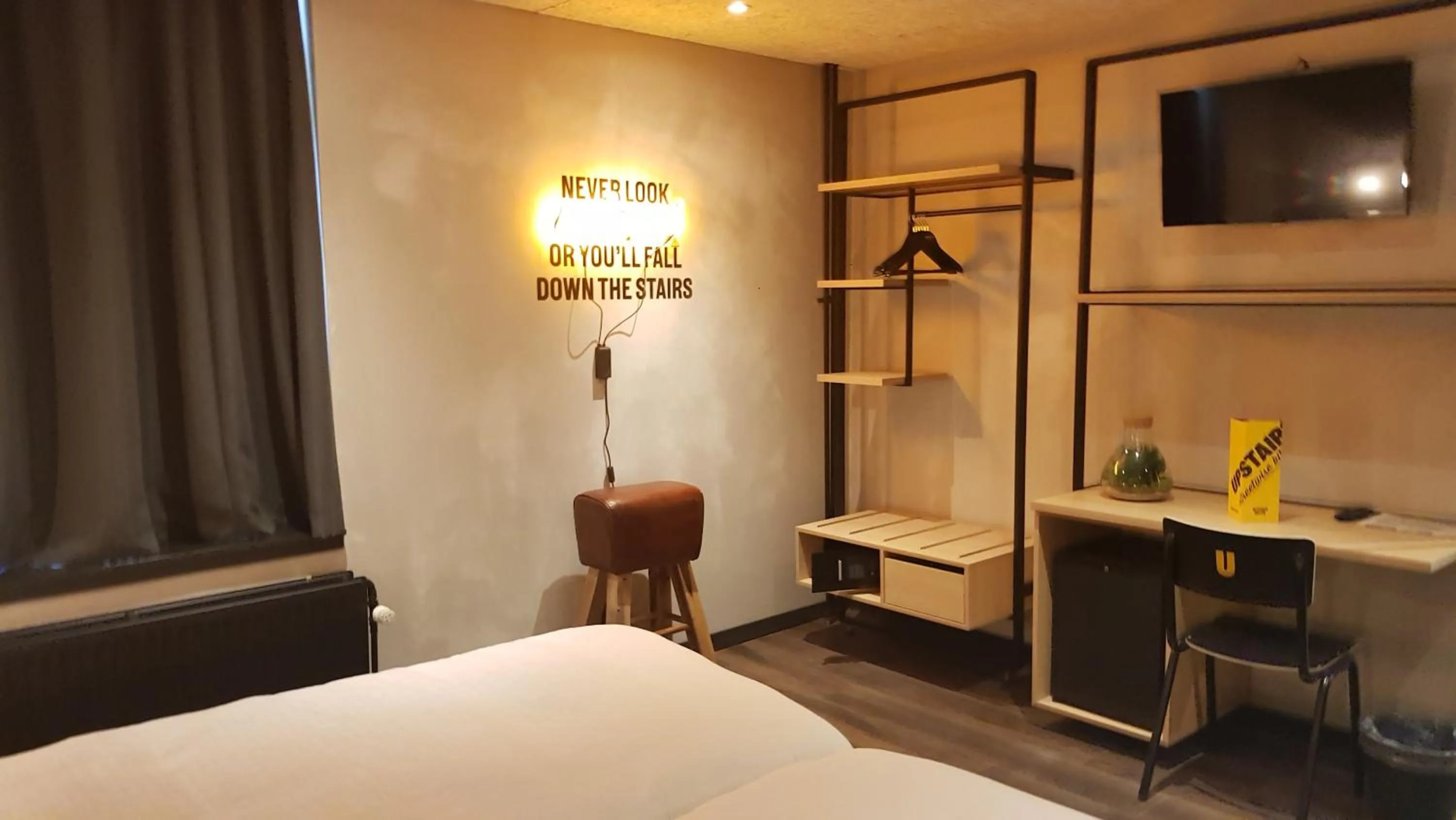 Bed in Upstairs Hotel