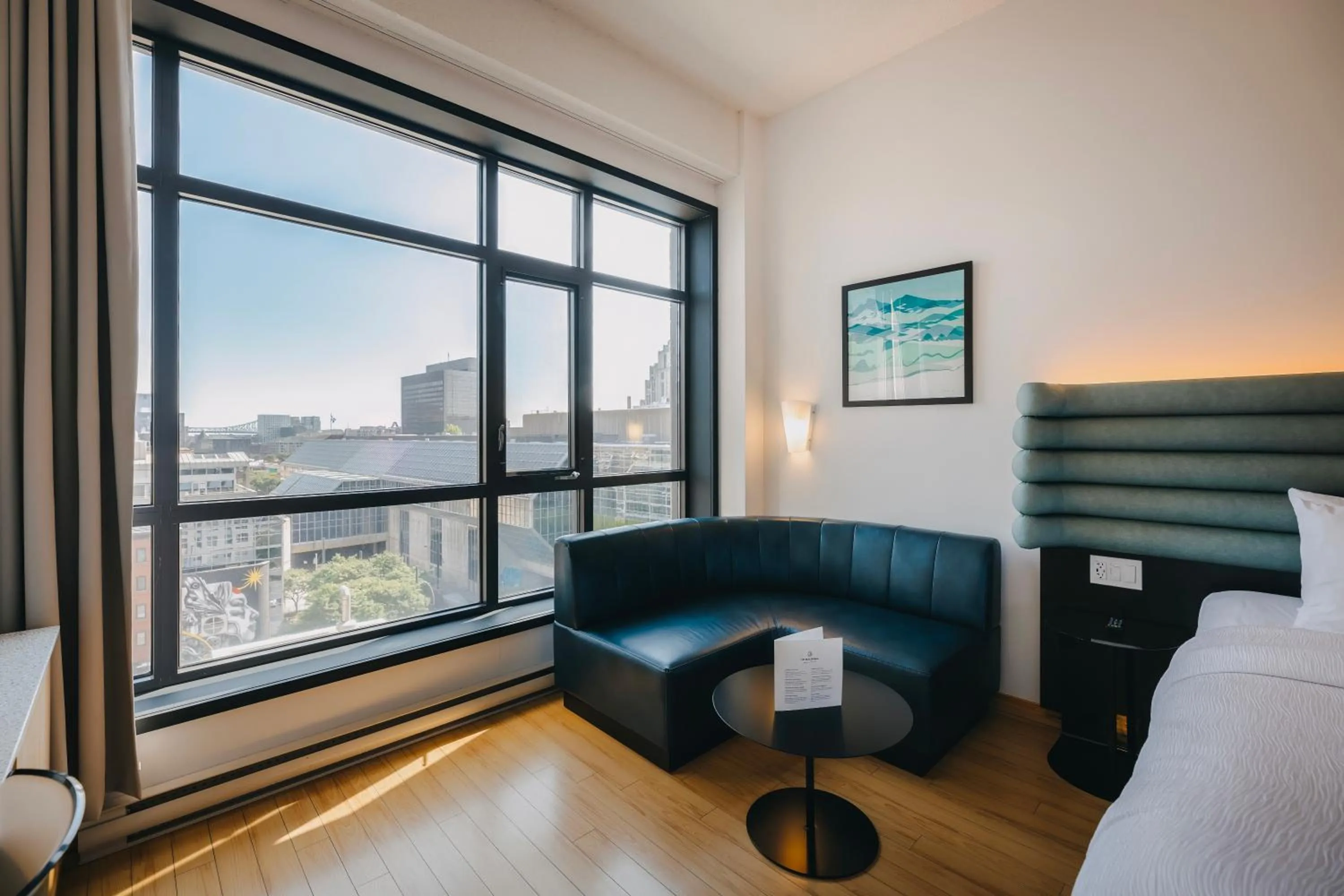 Bed in Le Dauphin Montréal Centre-Ville