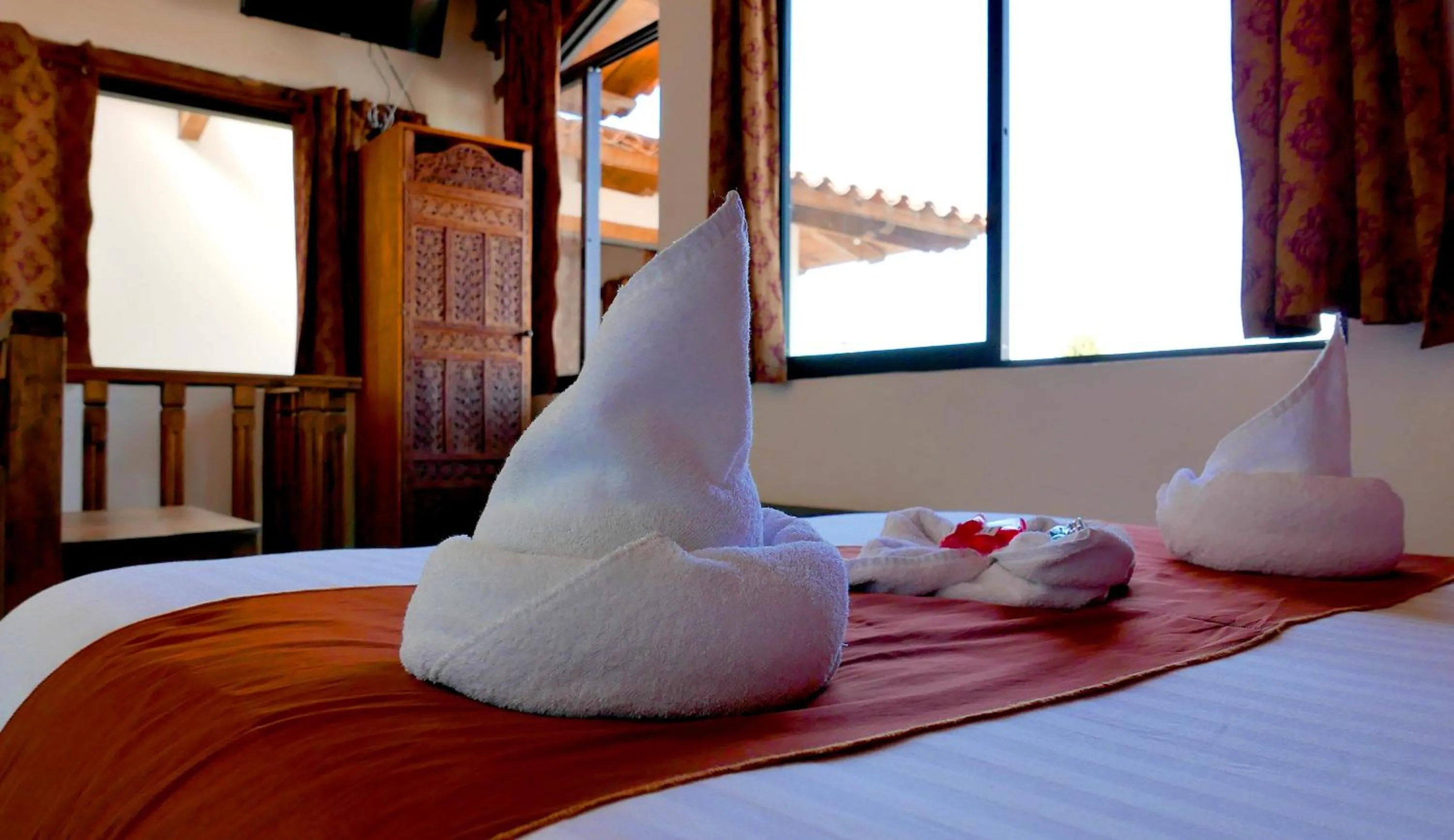 Bed in Ganesha Hotel