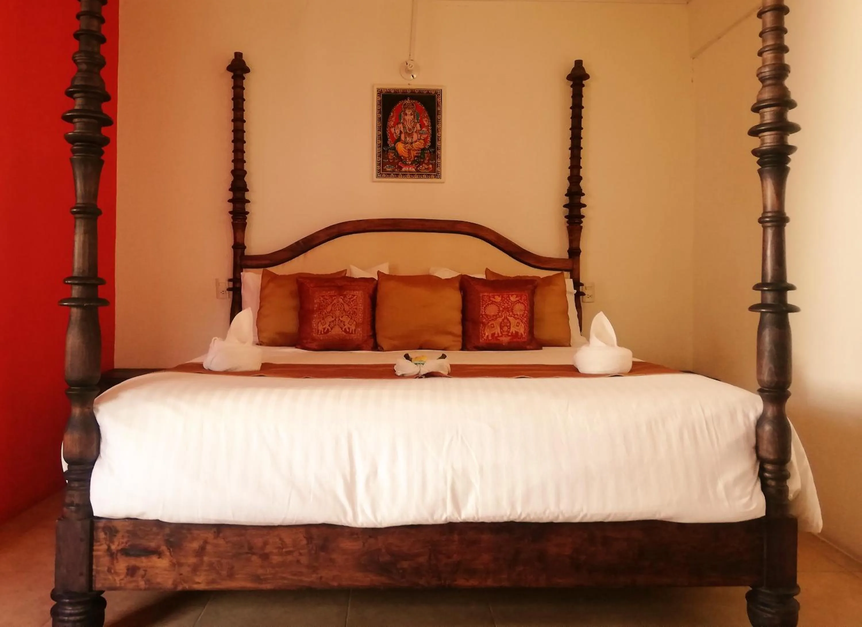 Bed in Ganesha Hotel