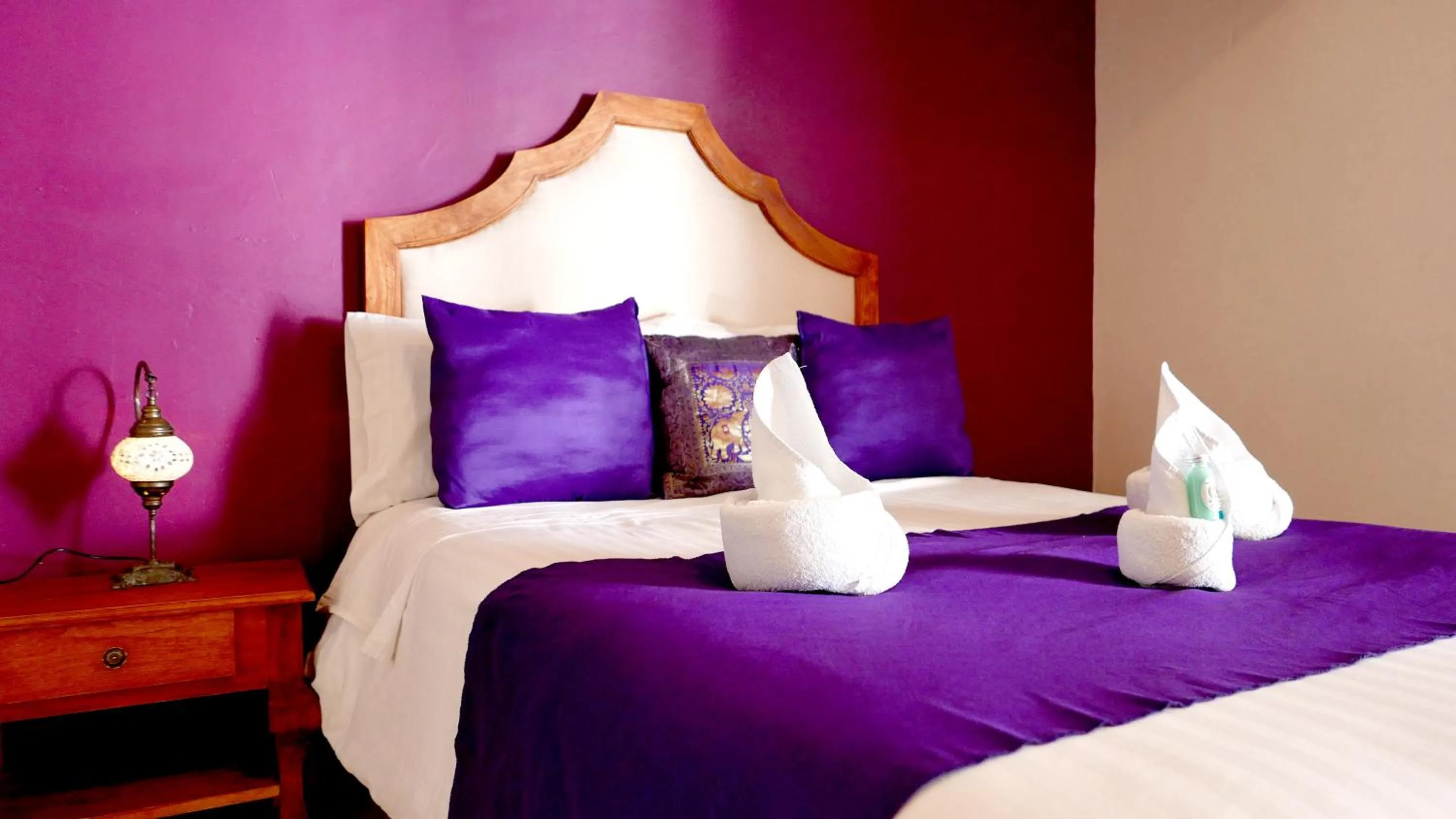 Bed in Ganesha Hotel