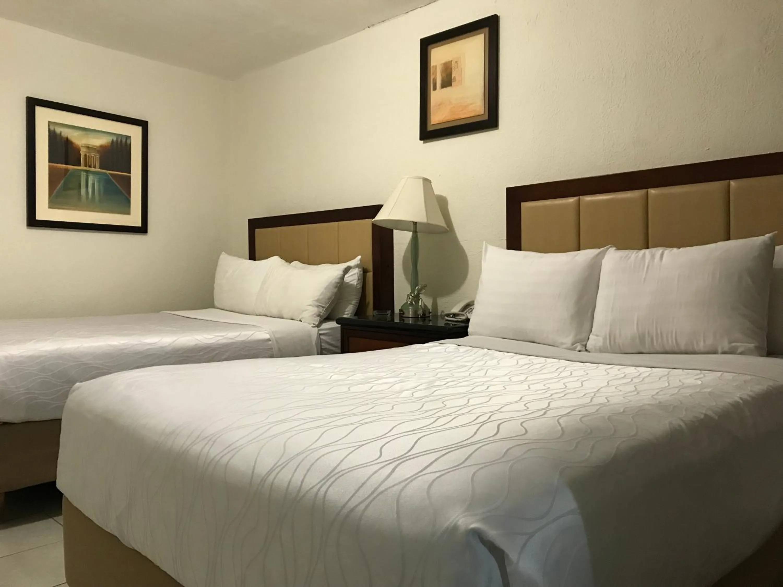 Bed in Hotel Guillen Jr