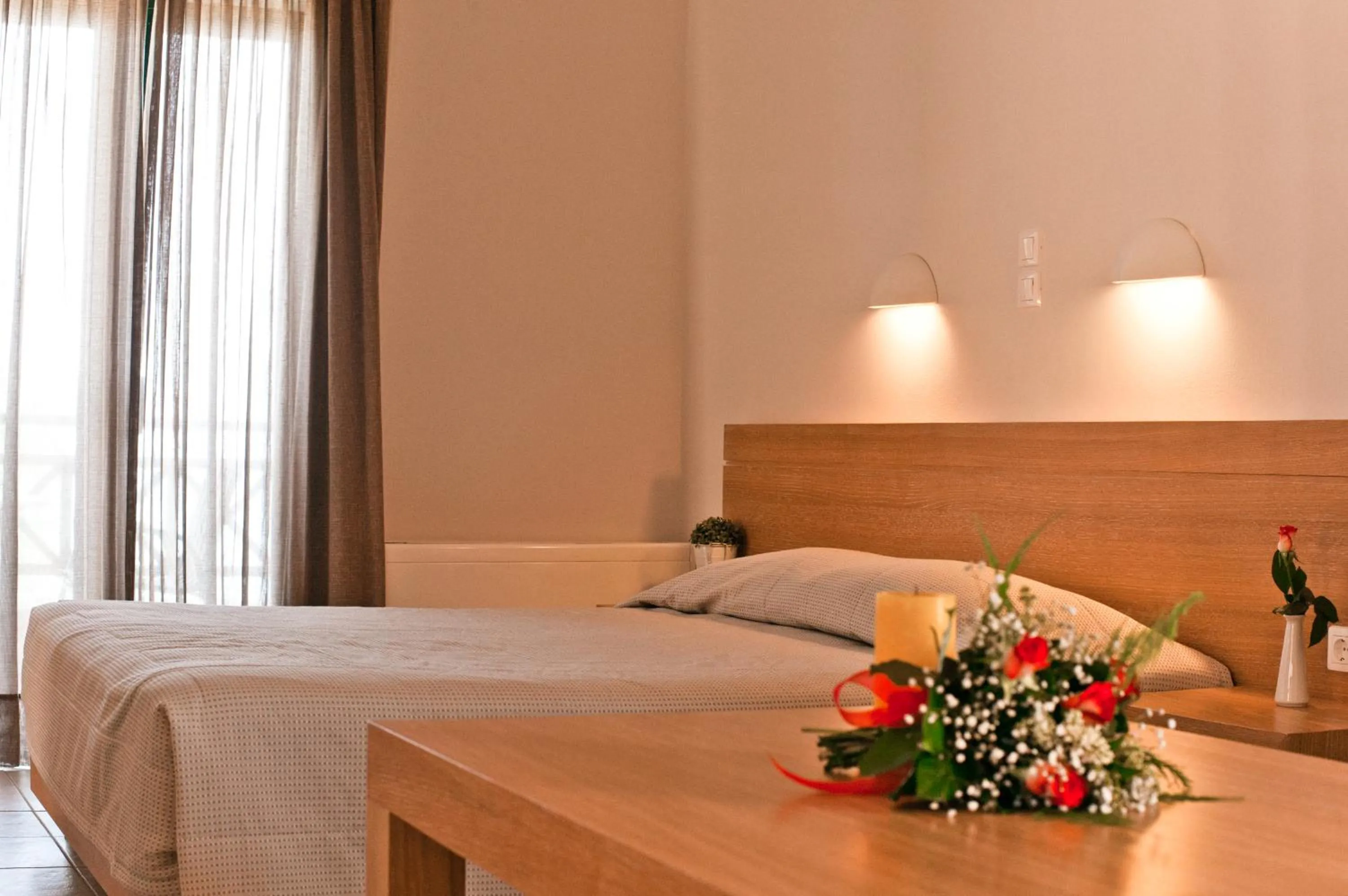 Bed in Silver Beach Hotel & Apartments