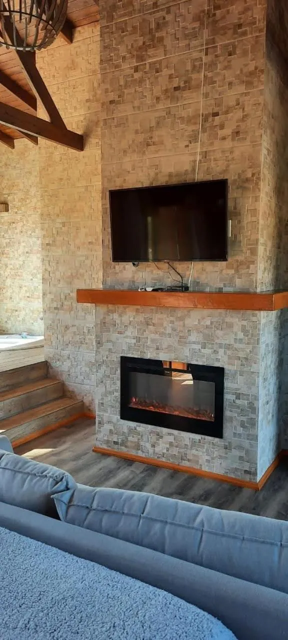 Communal lounge/ TV room in Pousada Recanto do Lago