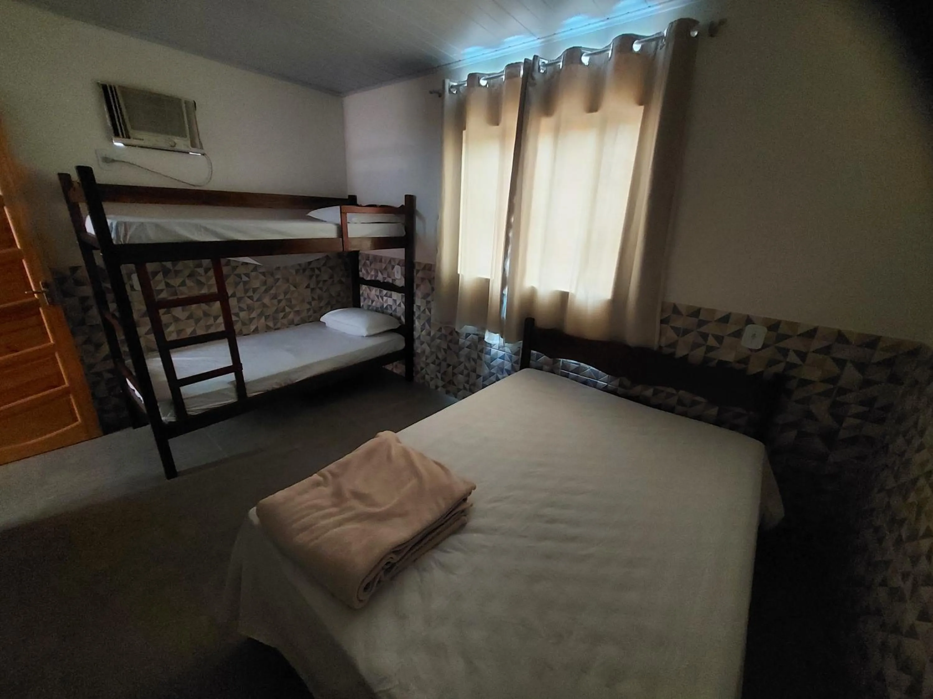 Bed in Pousada do Leô